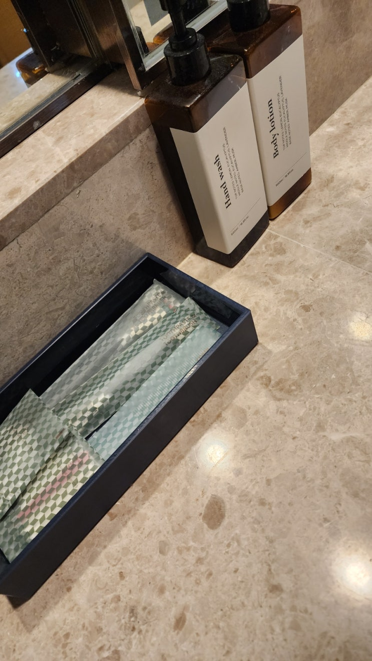 Hotel Hyundai by Lahan Ulsan marble bathroom with full bathtub