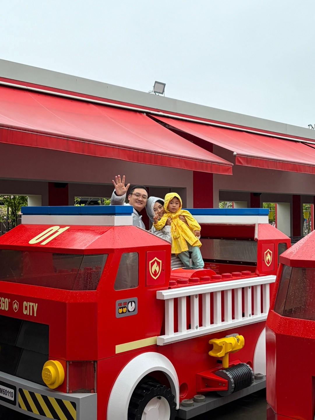 Family on giant LEGO fire truck at LEGOLAND Korea LEGO CITY zone