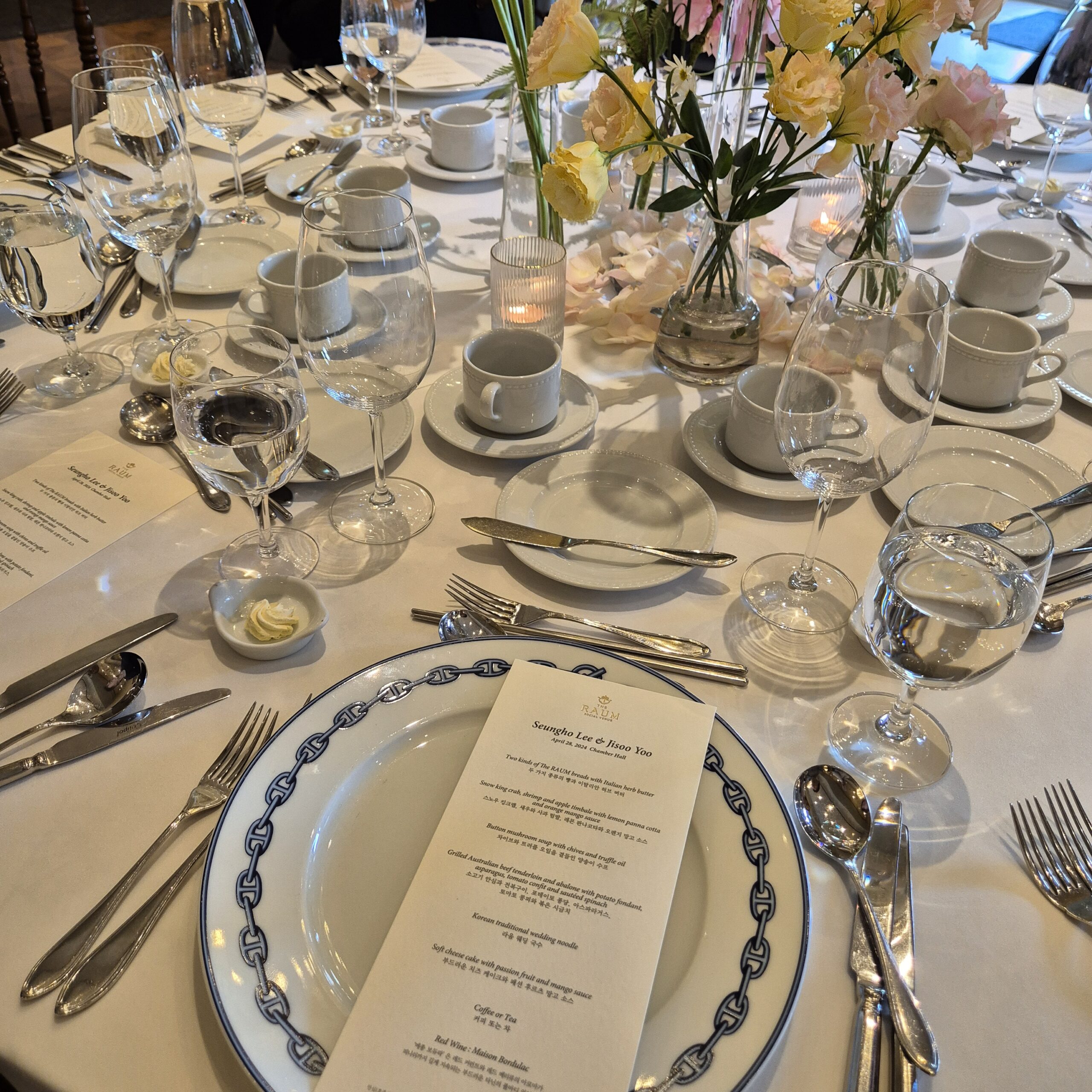 Korean hotel wedding table setting with printed course menu and elegant dinnerware Seoul