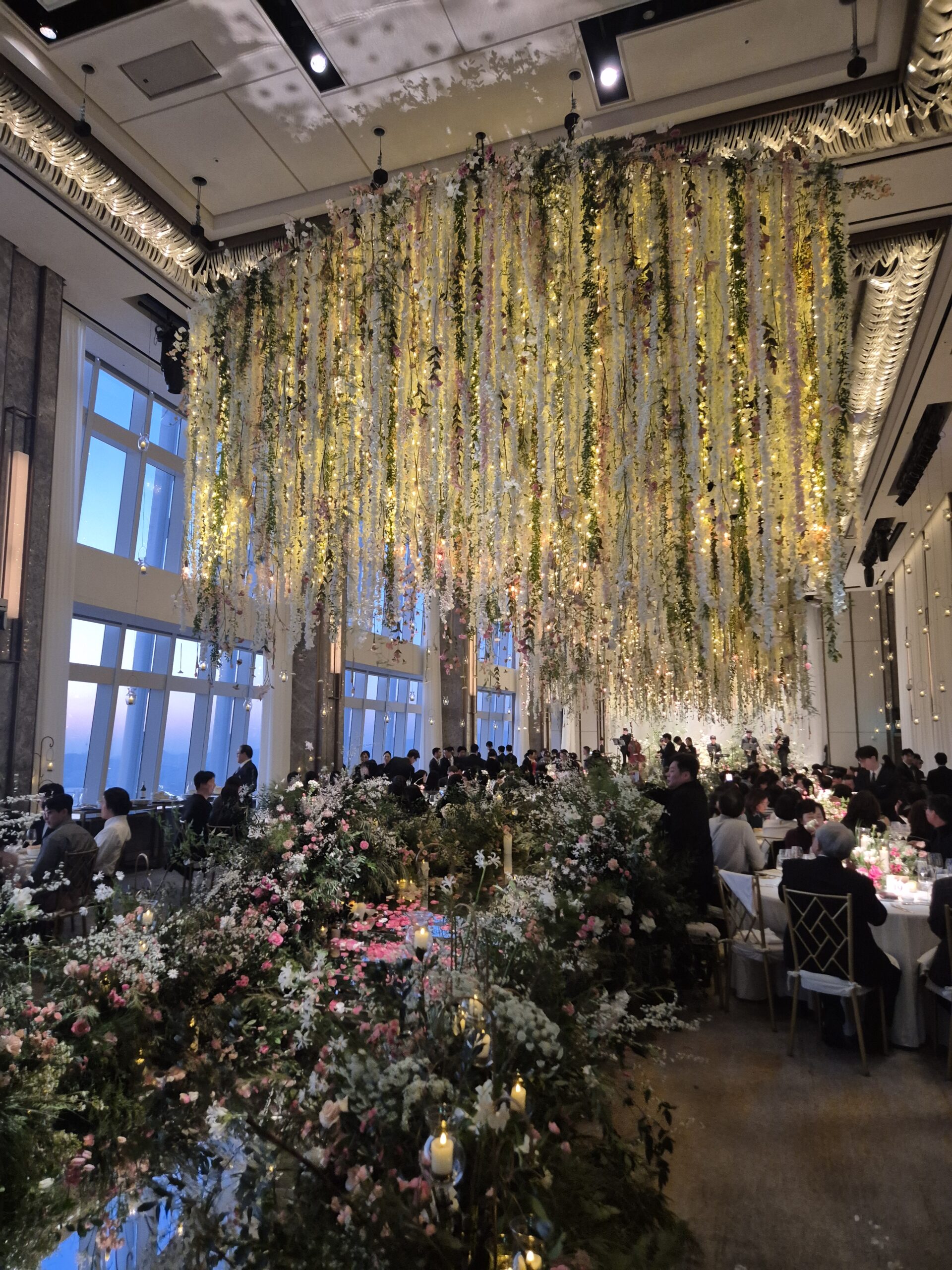 Elaborate floral cascade installation at Korean luxury hotel wedding reception Seoul