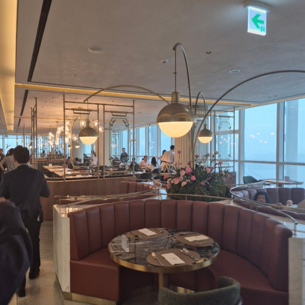 Hotel Naru Seoul M Gallery Voisin restaurant interior with Han River view