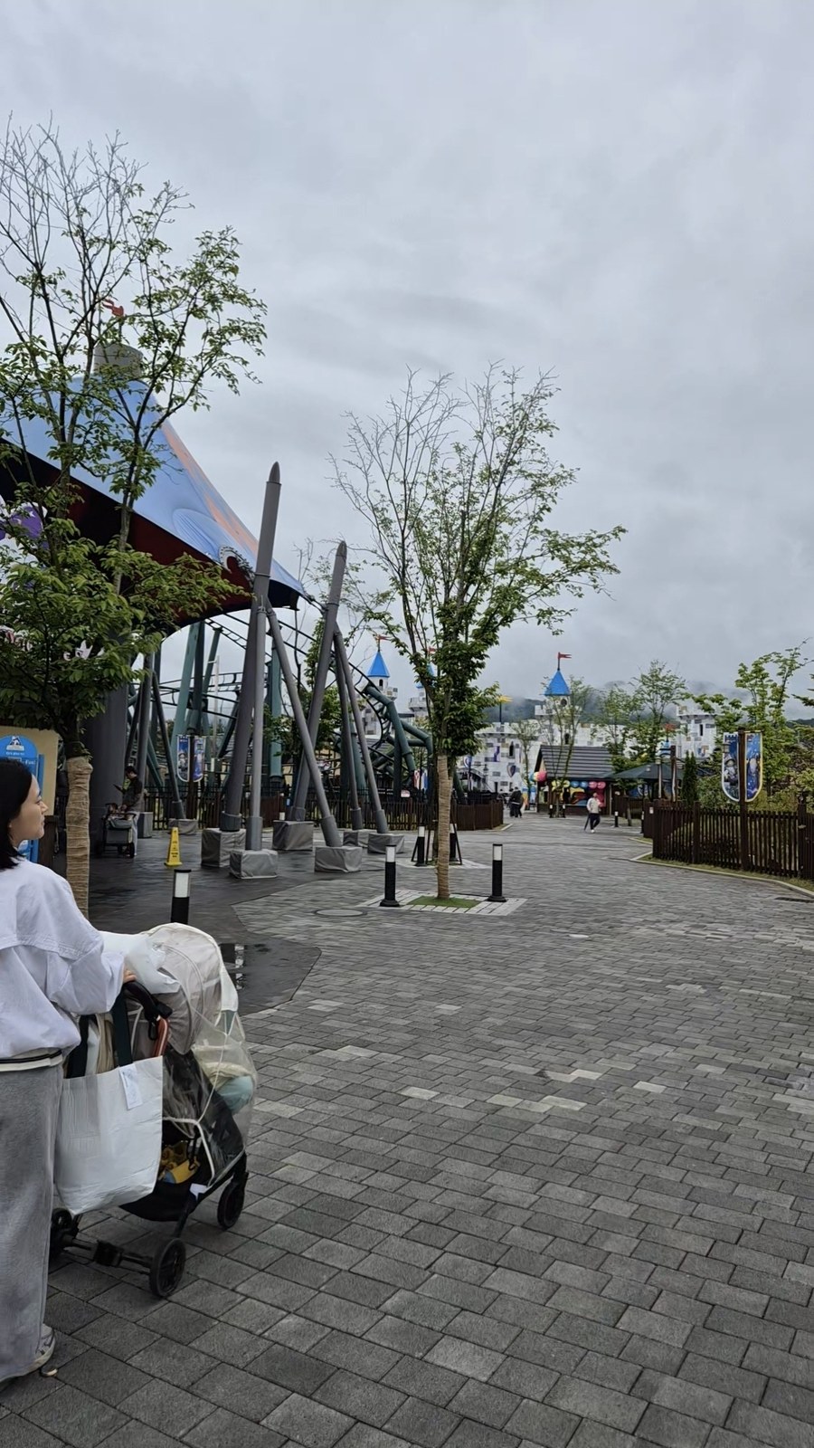 Quiet near-empty LegoLand Korea walkway on a rainy day