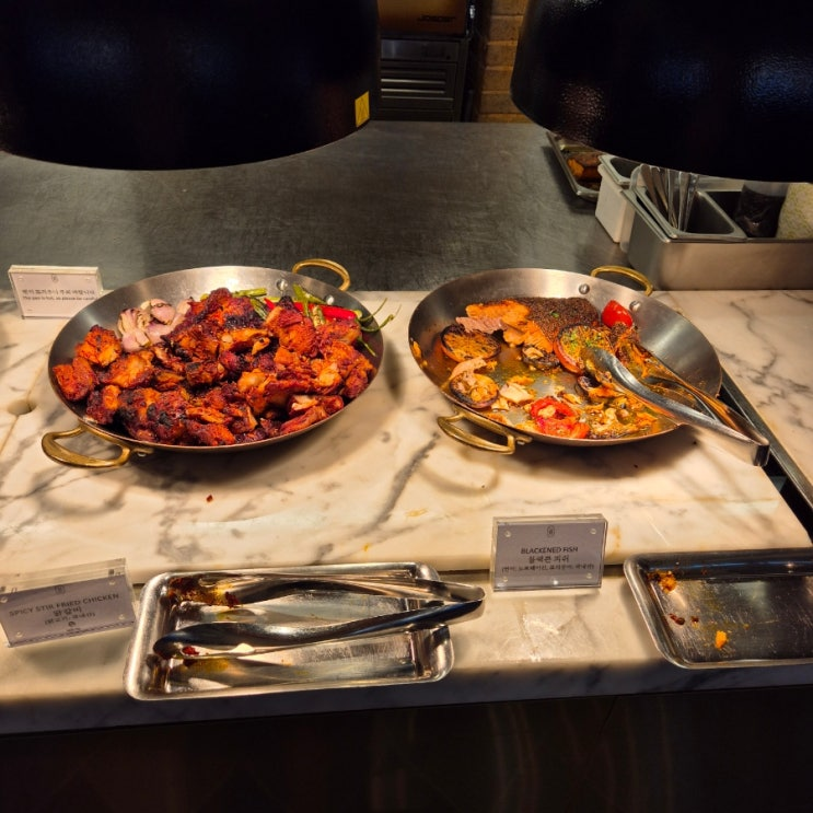 Hotel Naru Seoul breakfast cheese and charcuterie station with marble counter
