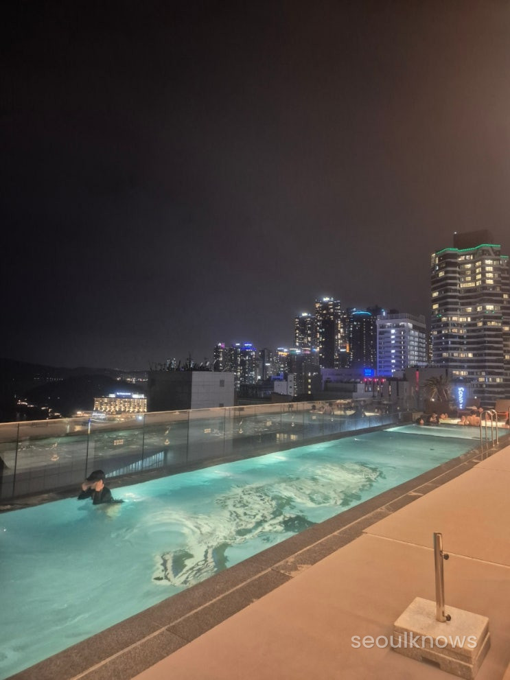 The 19F rooftop pool with the Haeundae horizon line in view.