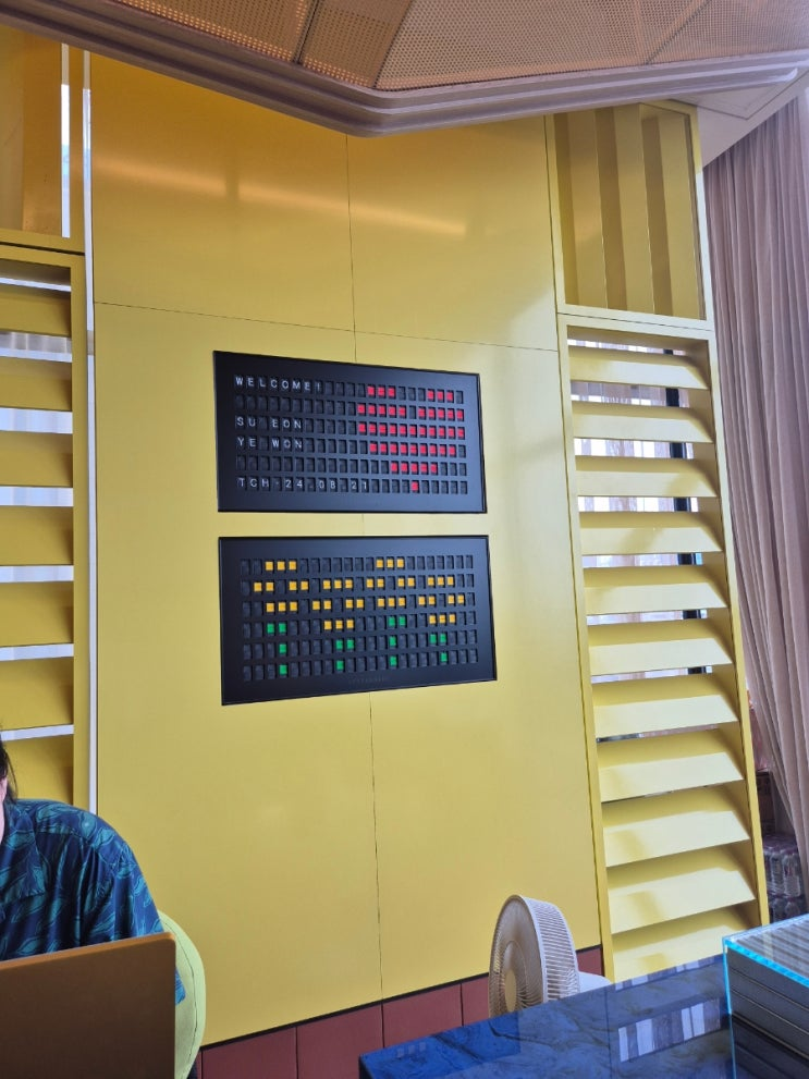 The Coolist Hotel Songjeong room interior with blue accent wall and designer furniture