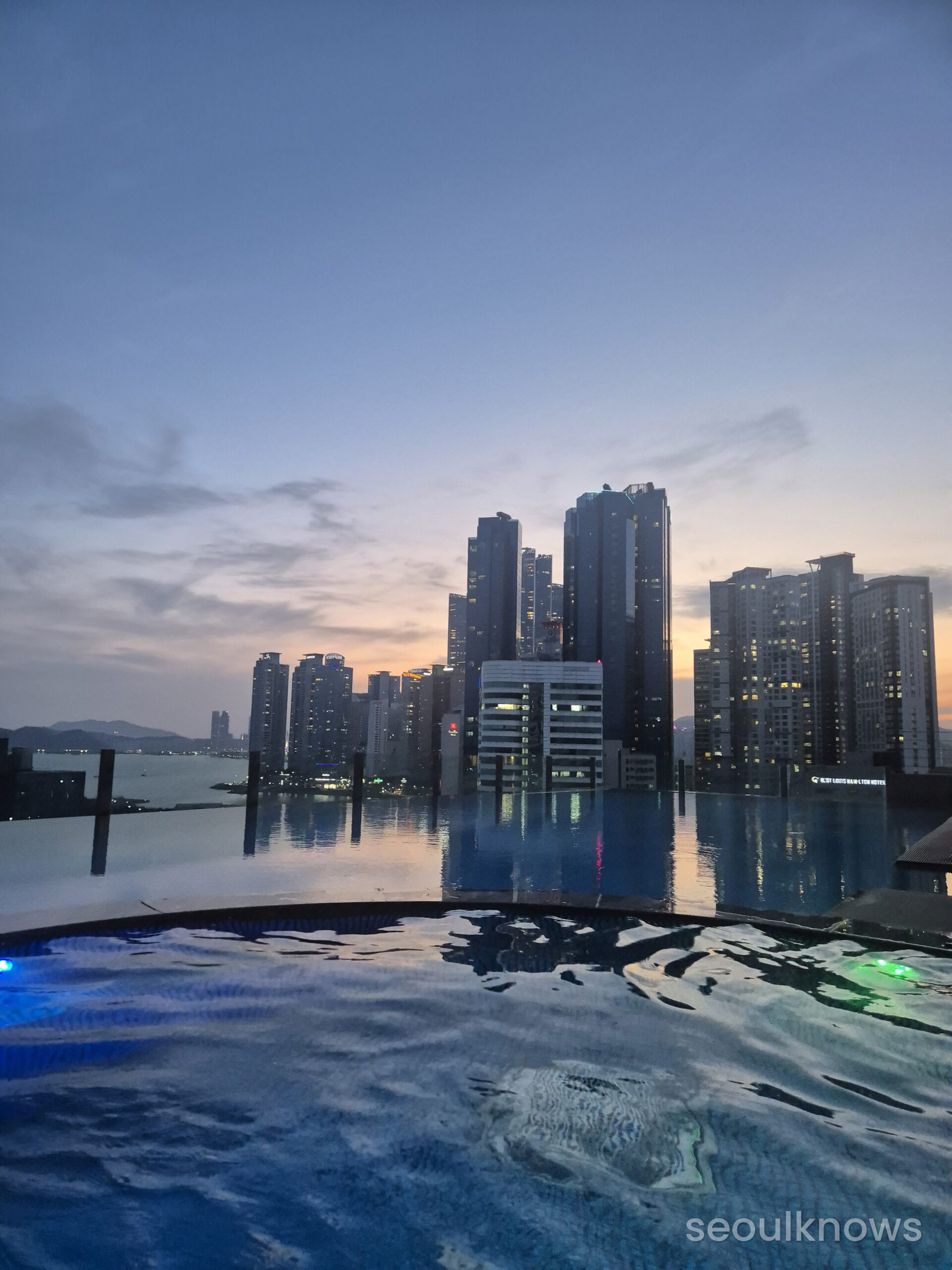 Baymond Hotel rooftop pool at night
