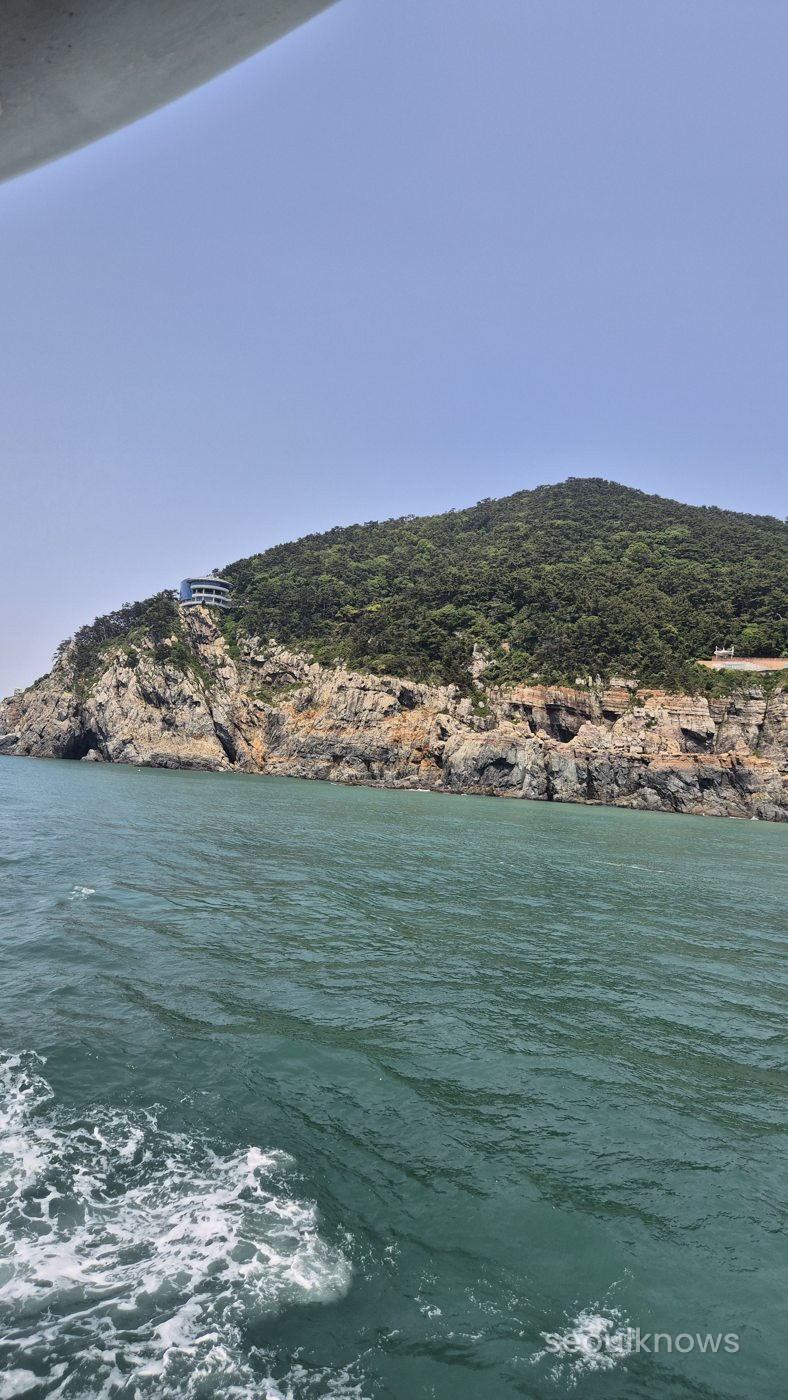 Cliffs and lighthouse from the Jagalchi Cruise