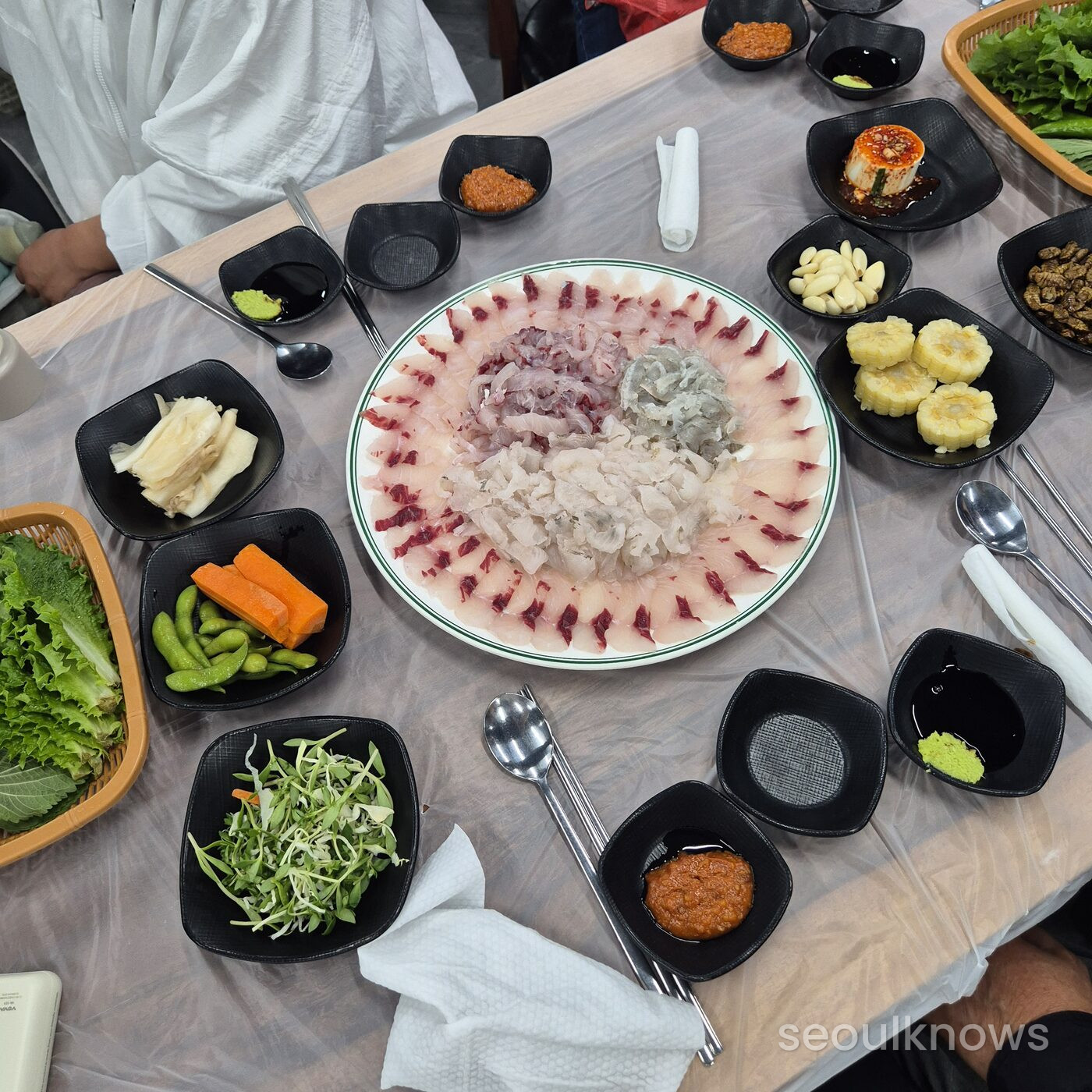 Full table spread of hoe and many side dishes at Millak
