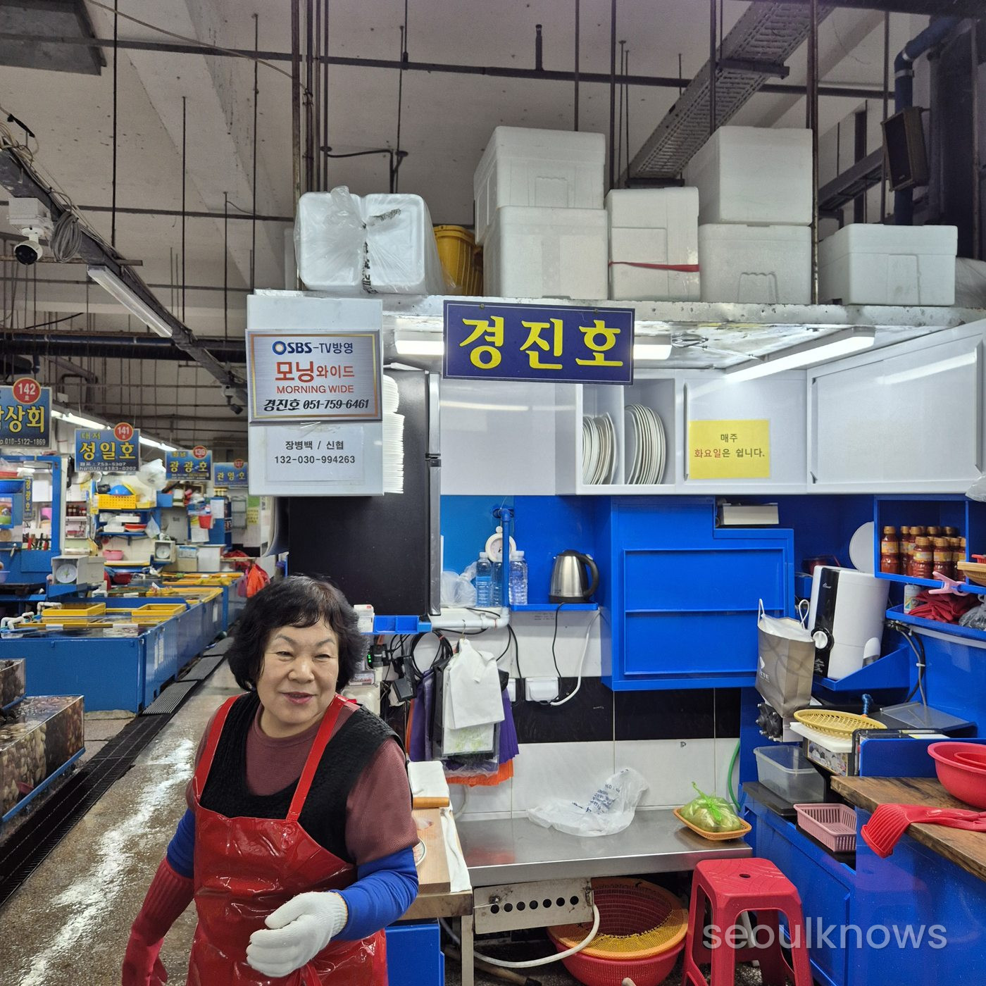 The owner at Gyeongjinho, Stall No. 79, Millak Live Fish Market