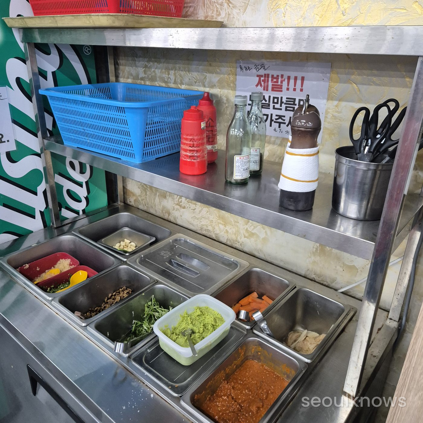 The self-bar of sauces and side dishes upstairs at Millak