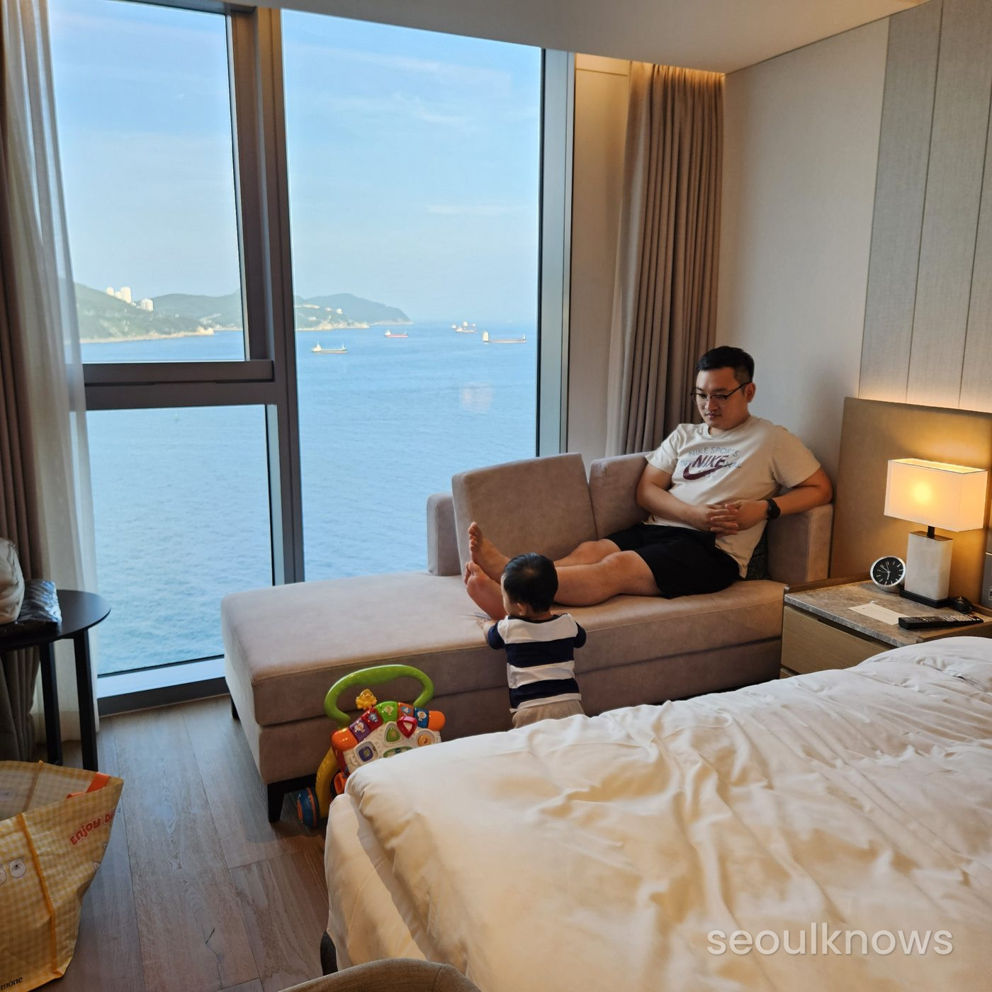 Ocean view from a Wyndham Grand Busan room with a baby