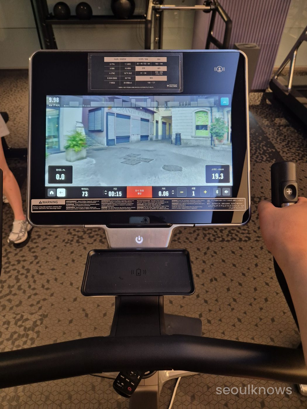 Screen-equipped exercise bike at Wyndham Grand Busan gym
