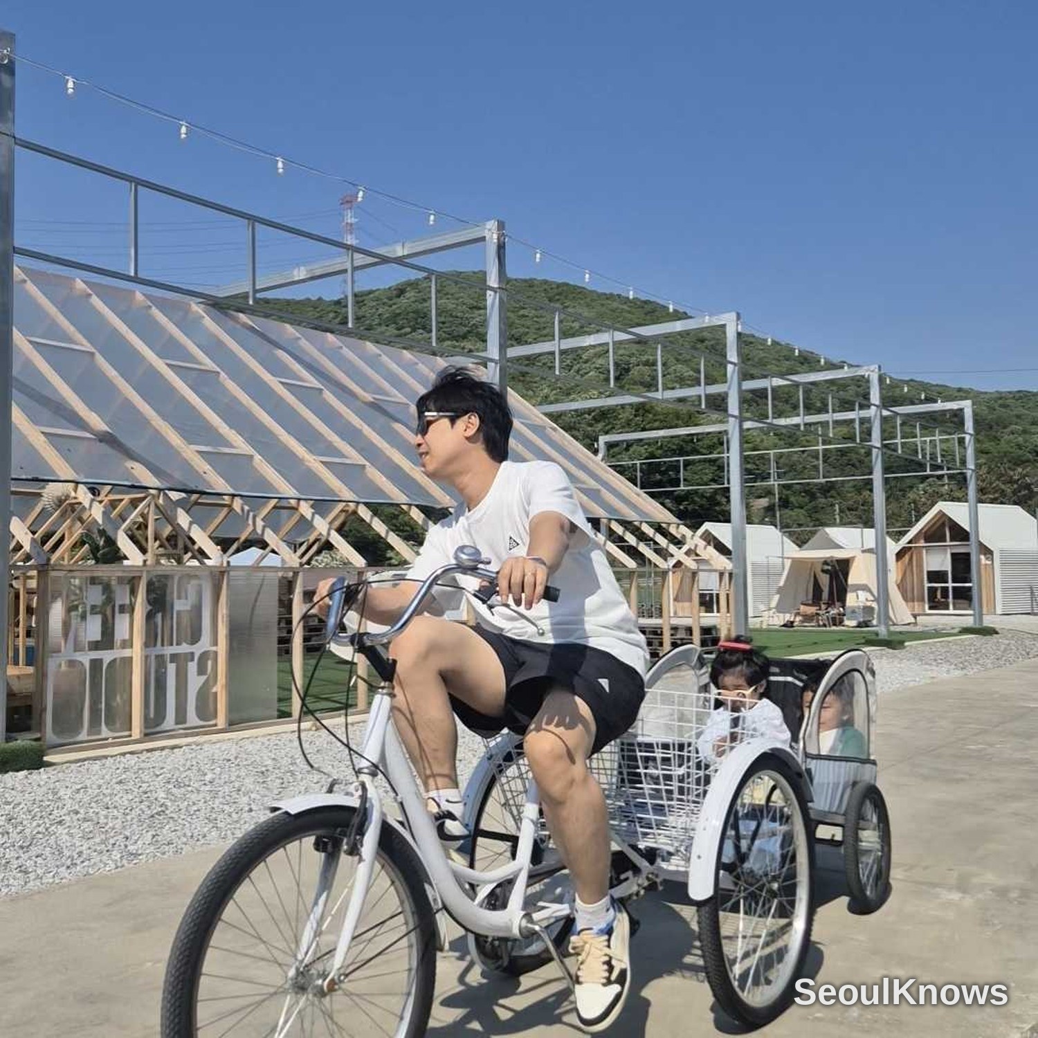 HAUS PLAY LAB adult riding a bike