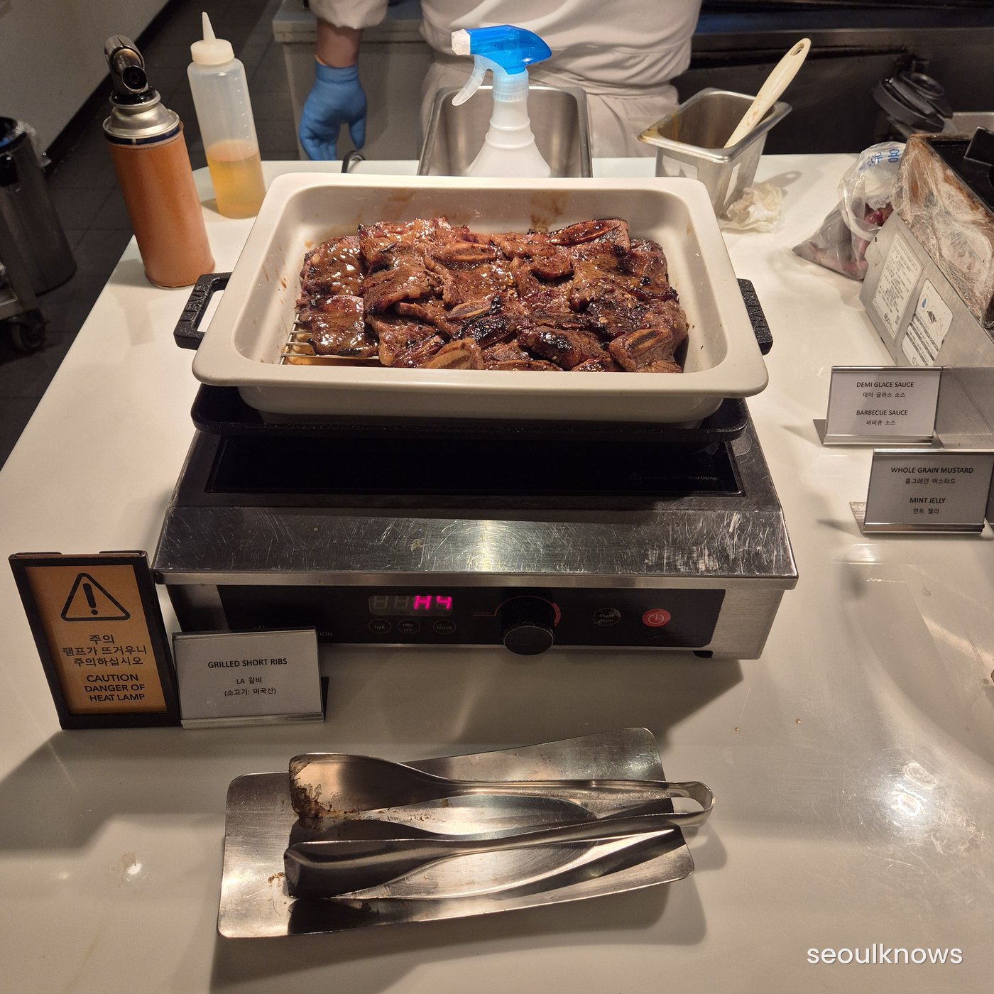 Charcoal rotisserie grill station at da MOIM buffet