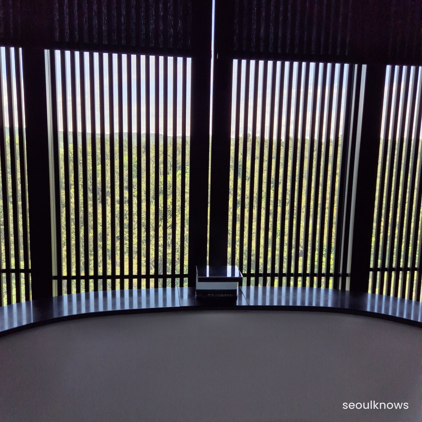 Forest-view room with wood-slat wall at Ananti Cove