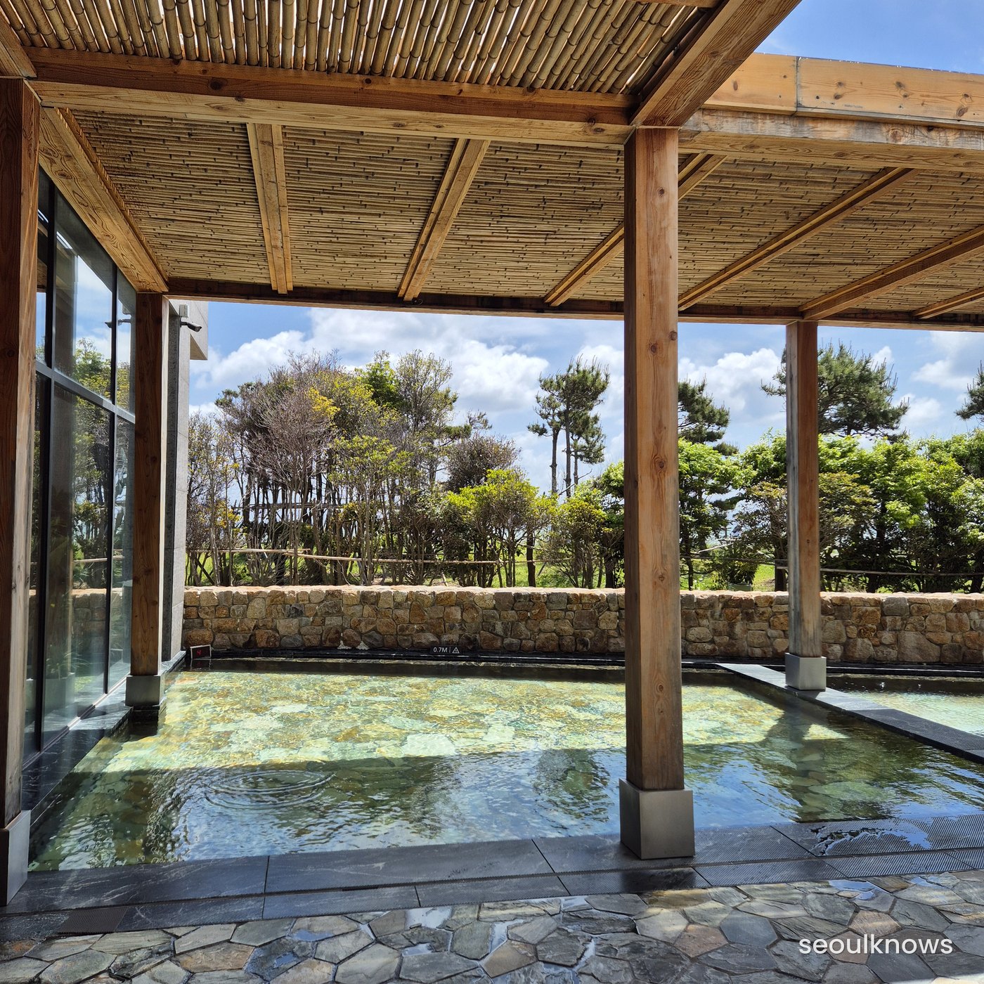 Outdoor open-air bath facing the sea at Ananti Cove