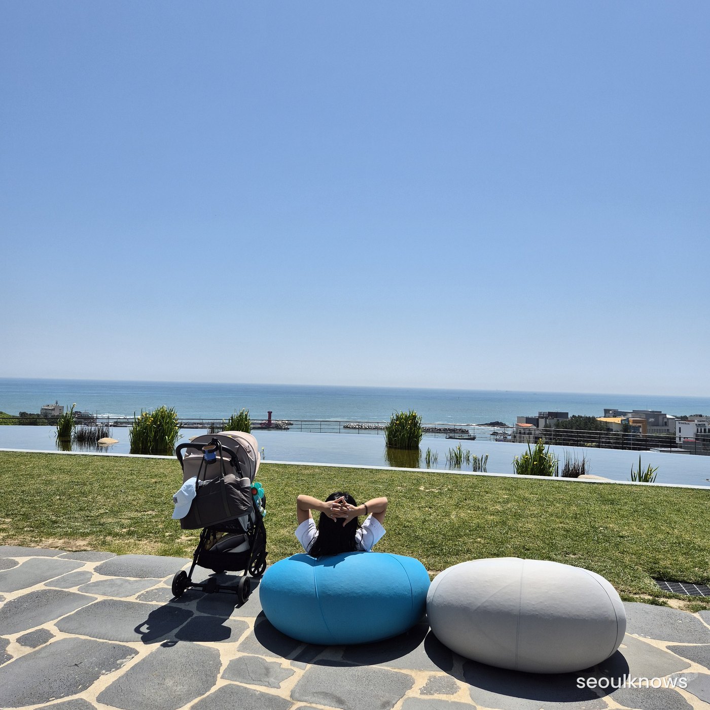 Grass lawn and stroller by the sea at Ananti at Busan Cove