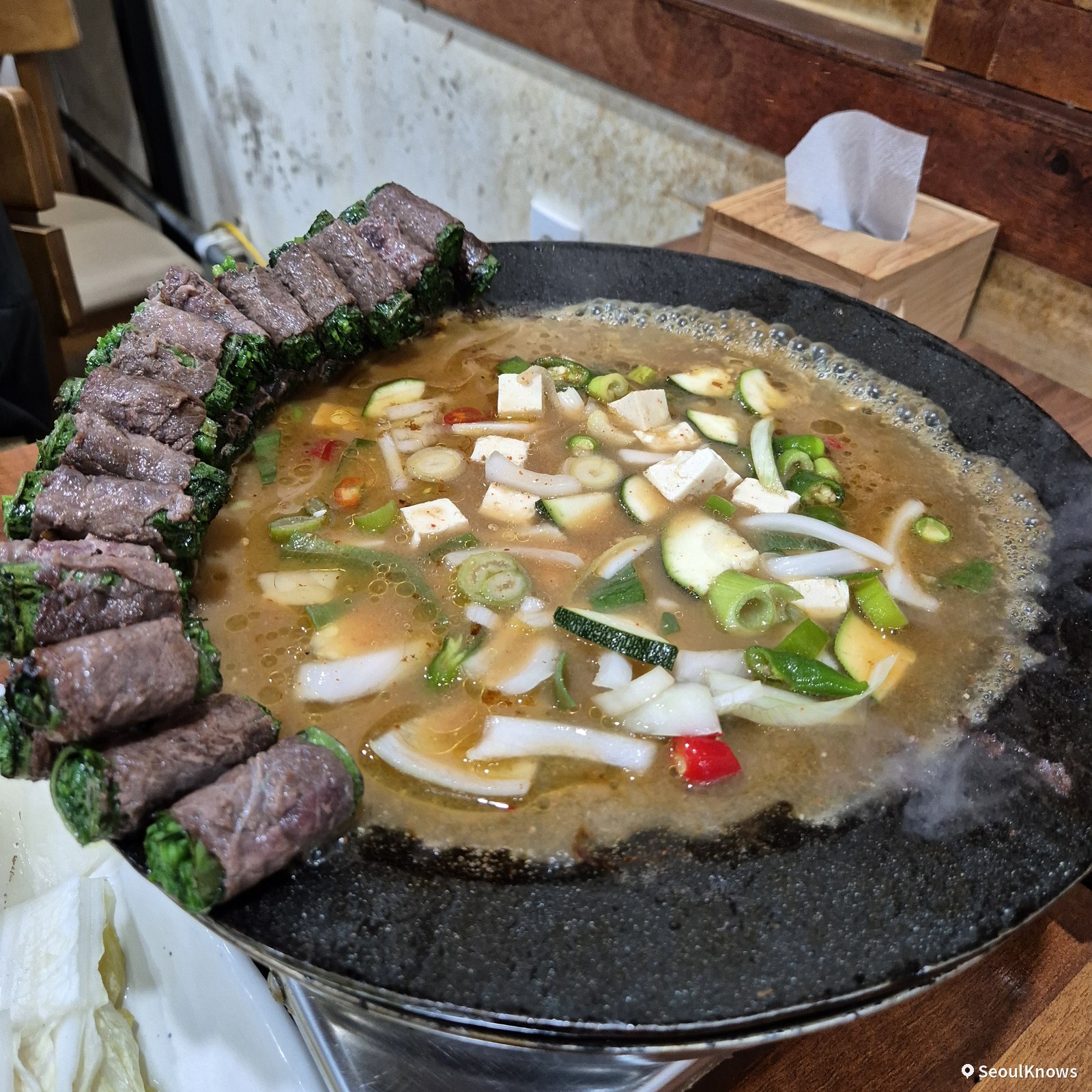 Doenjang stew poured onto the grill after the beef at Asura