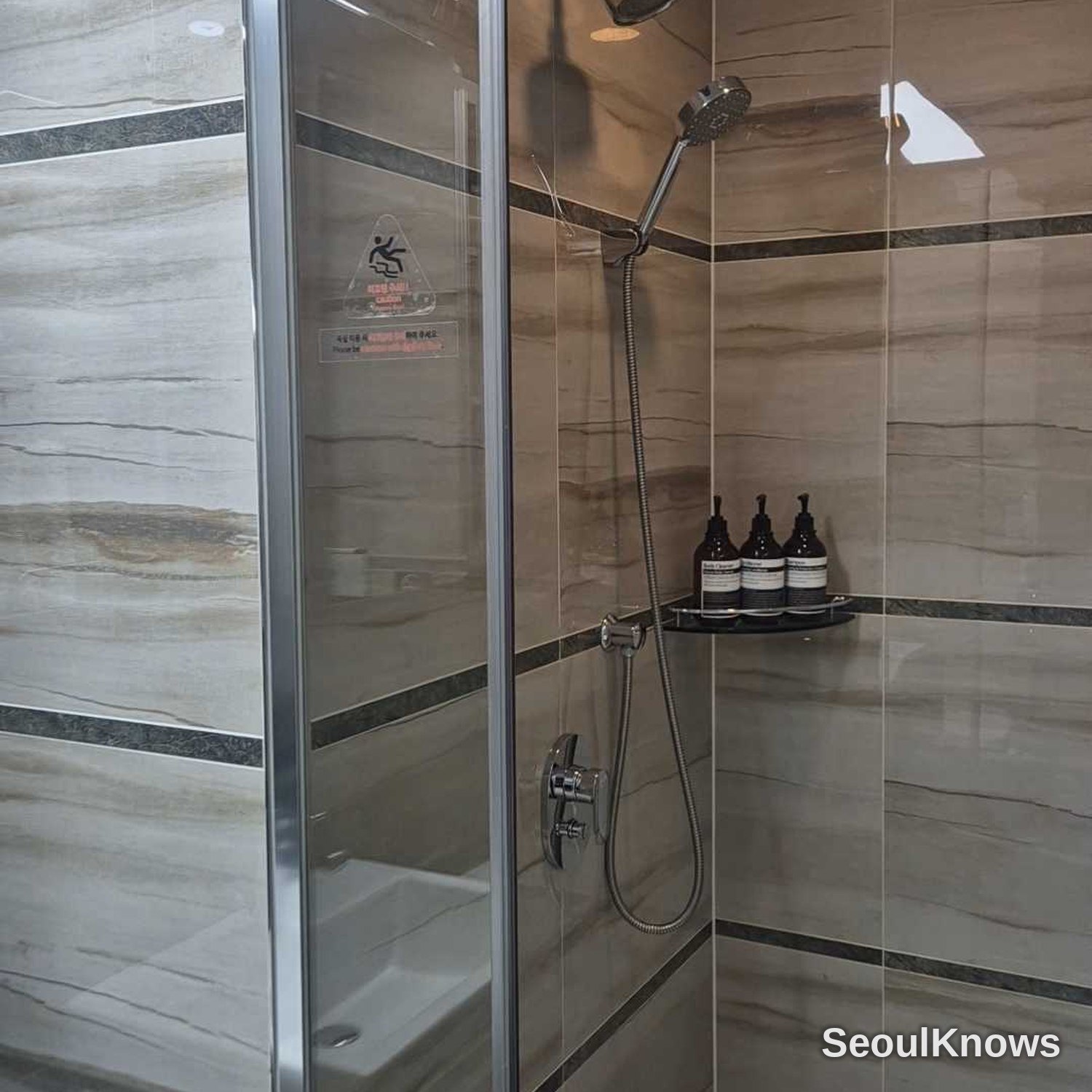 Brown Suites Busan marble shower booth