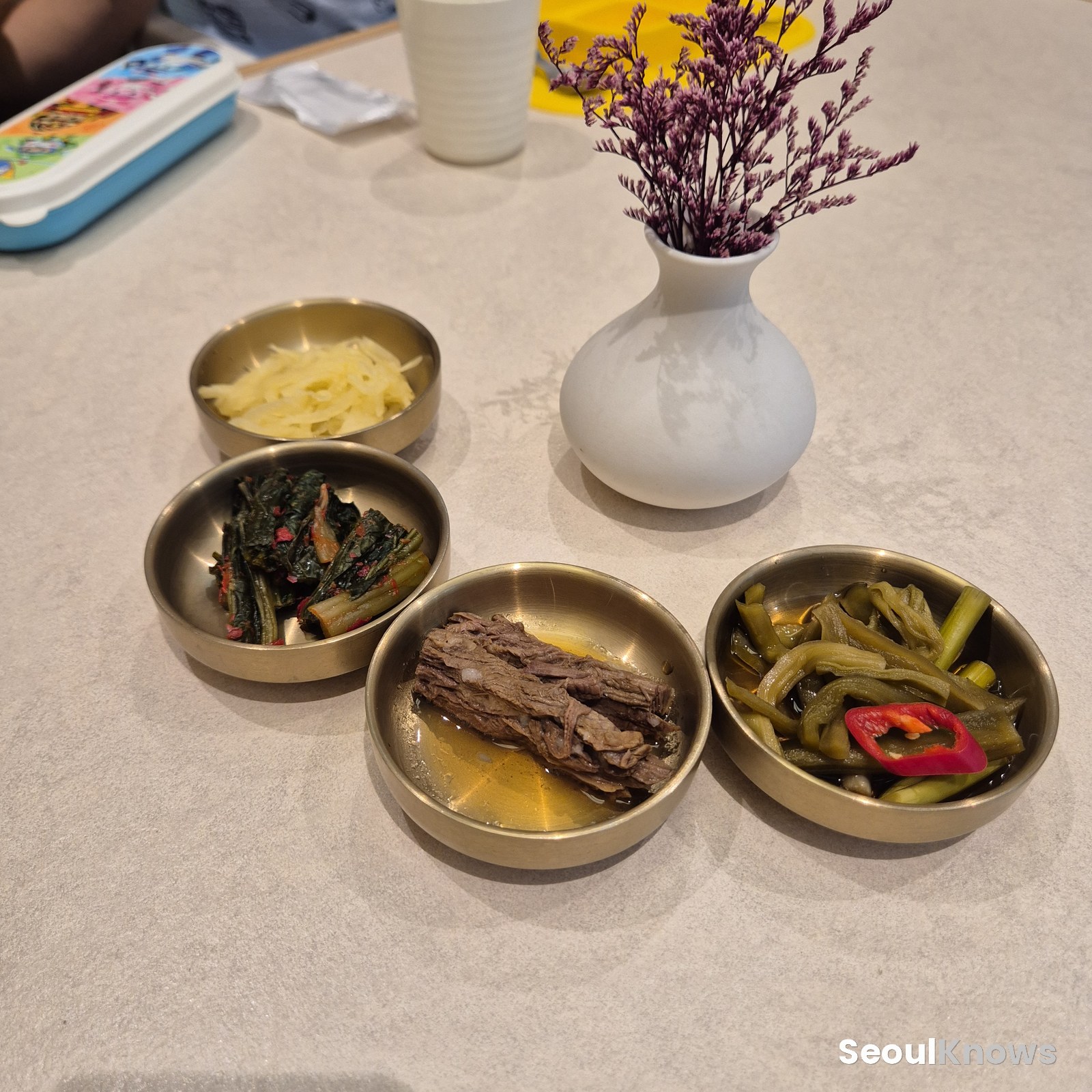 Brass bowls of Korean side dishes (banchan)