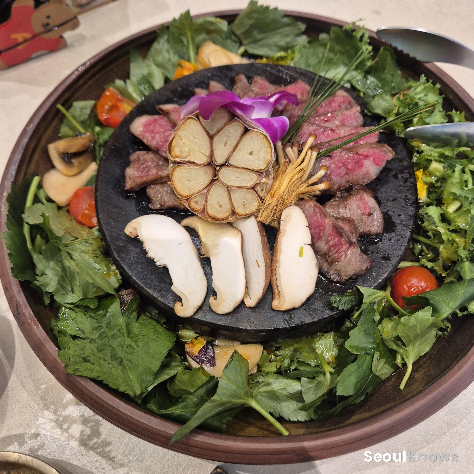 Marinated short rib main course with wild greens salad