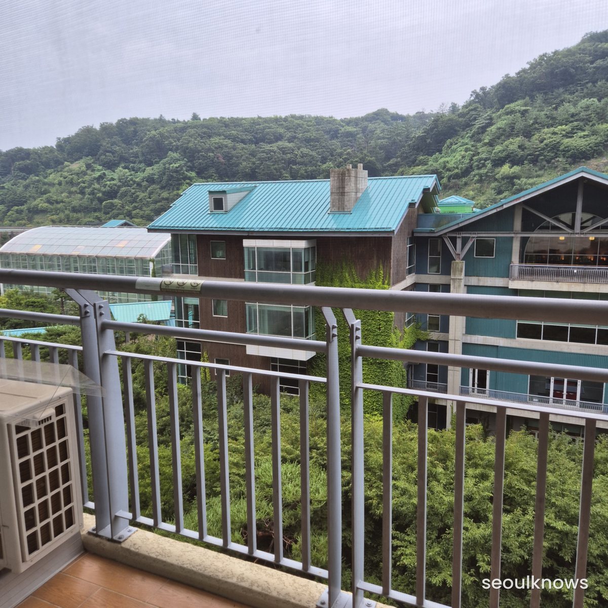 Green mountain and resort view from the condo balcony