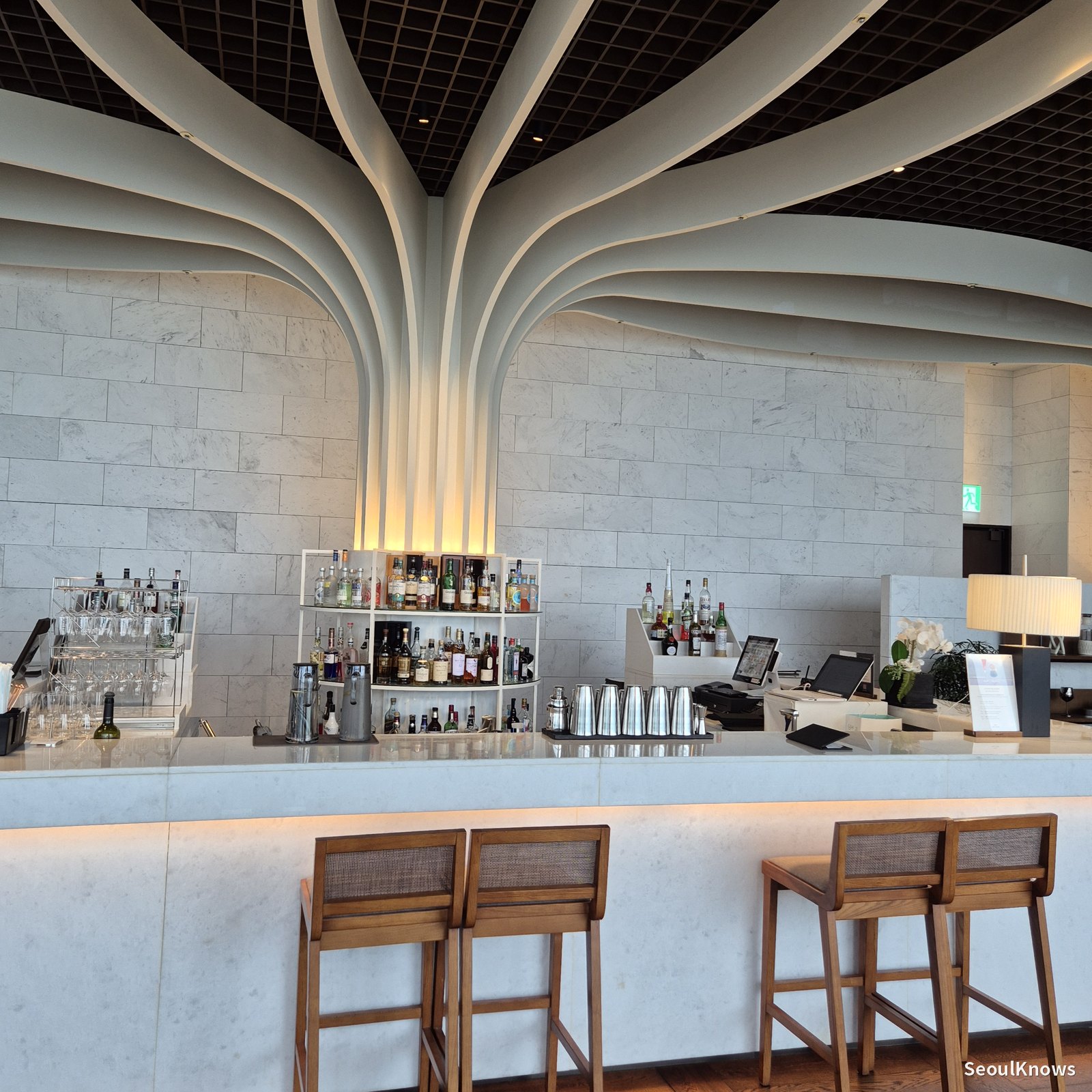Sculptural tree-column ceiling inside McQueens Grill and Bar Busan