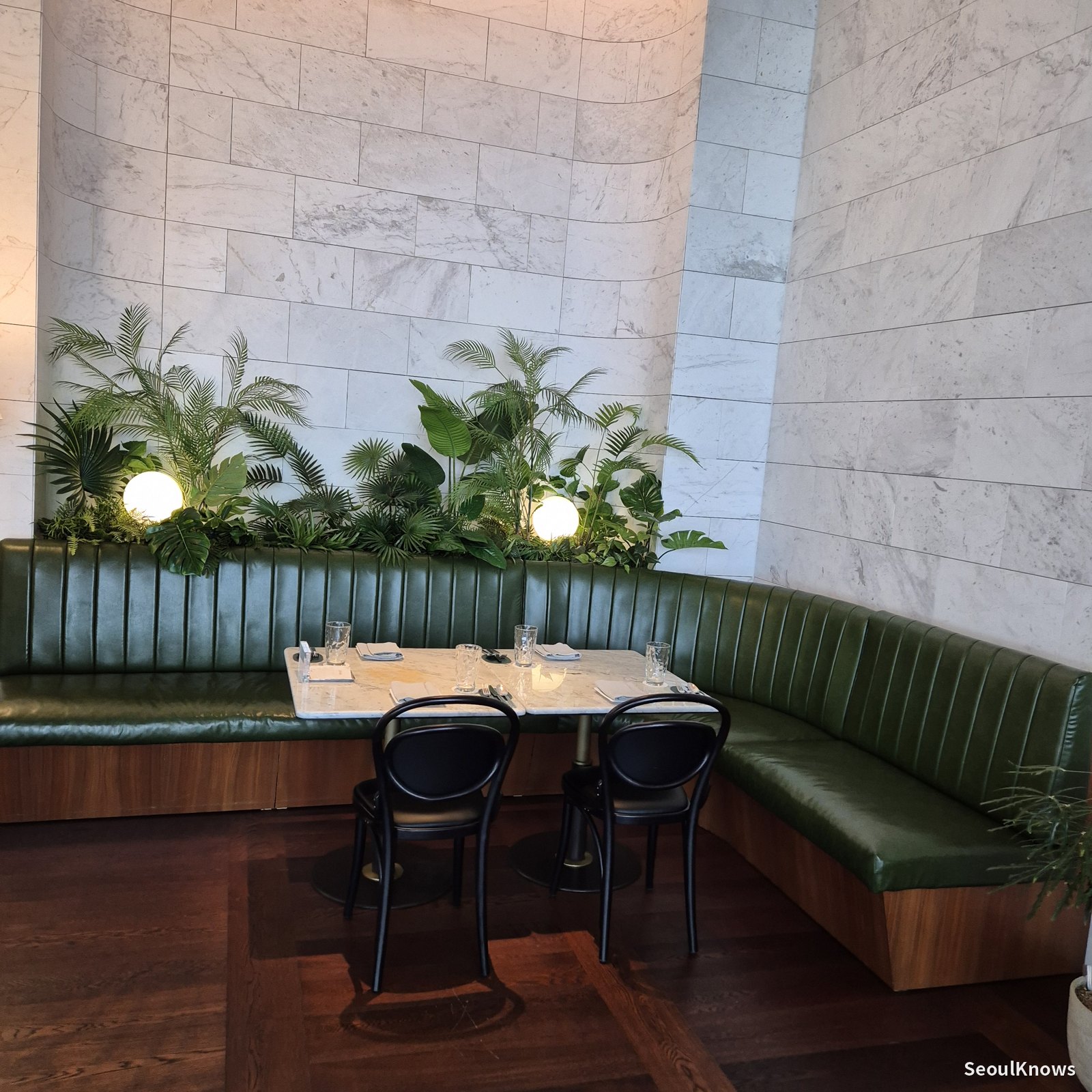 Green banquette seating at McQueens Grill and Bar