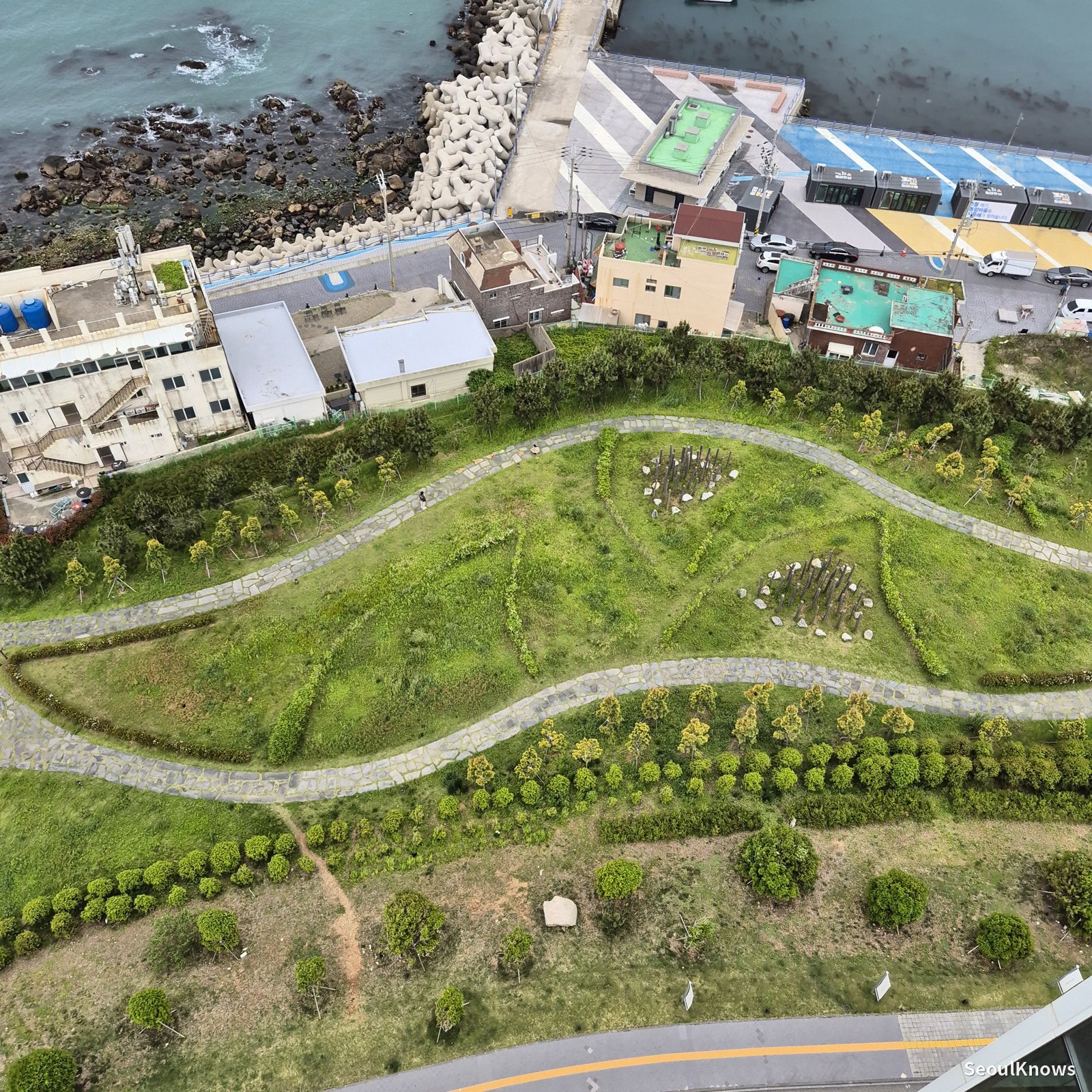 Coastal gardens and walking paths below Ananti at Busan Cove