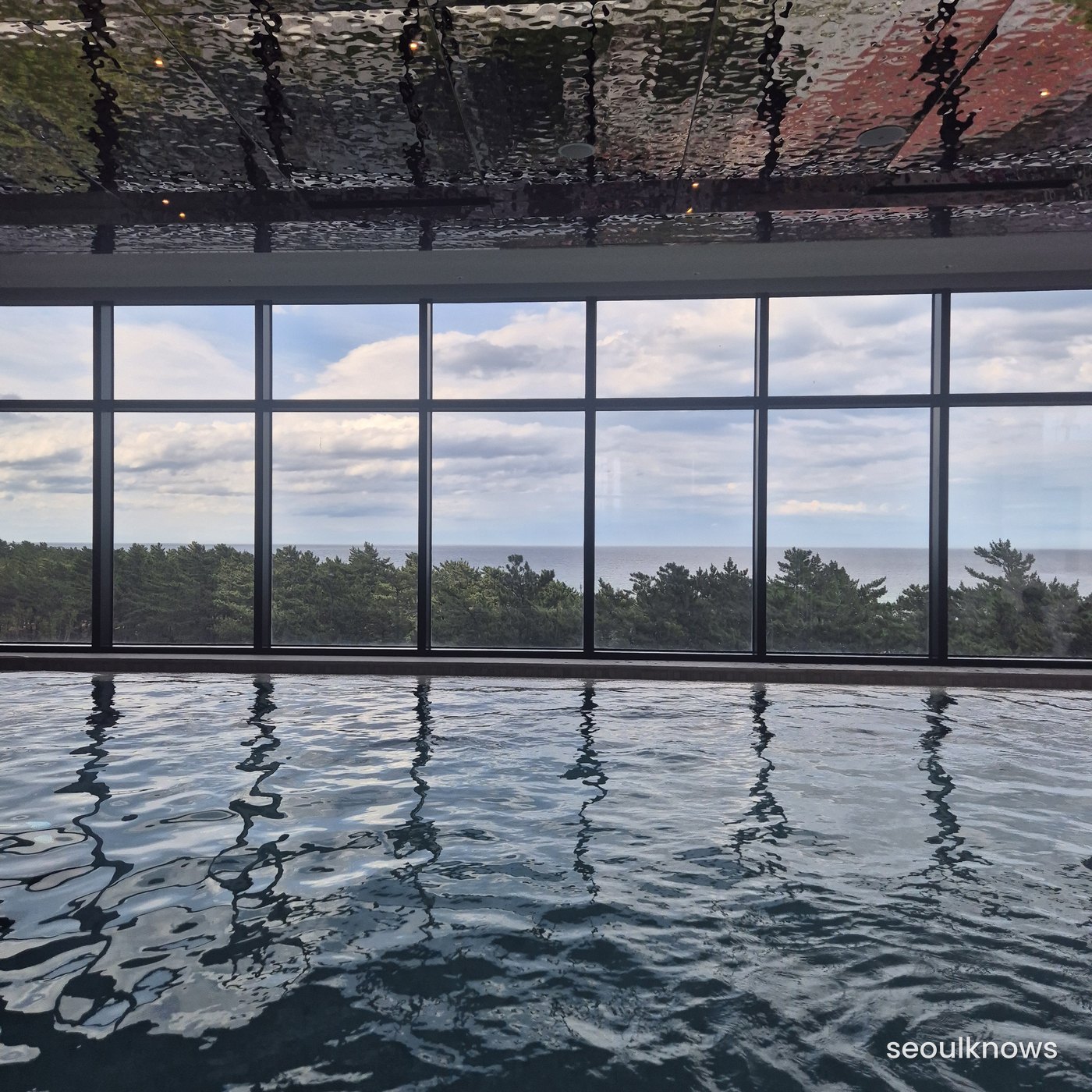 Indoor pool with sea-view windows