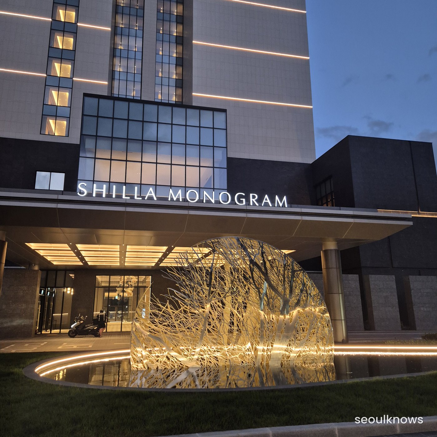 Hotel entrance lit up in the evening