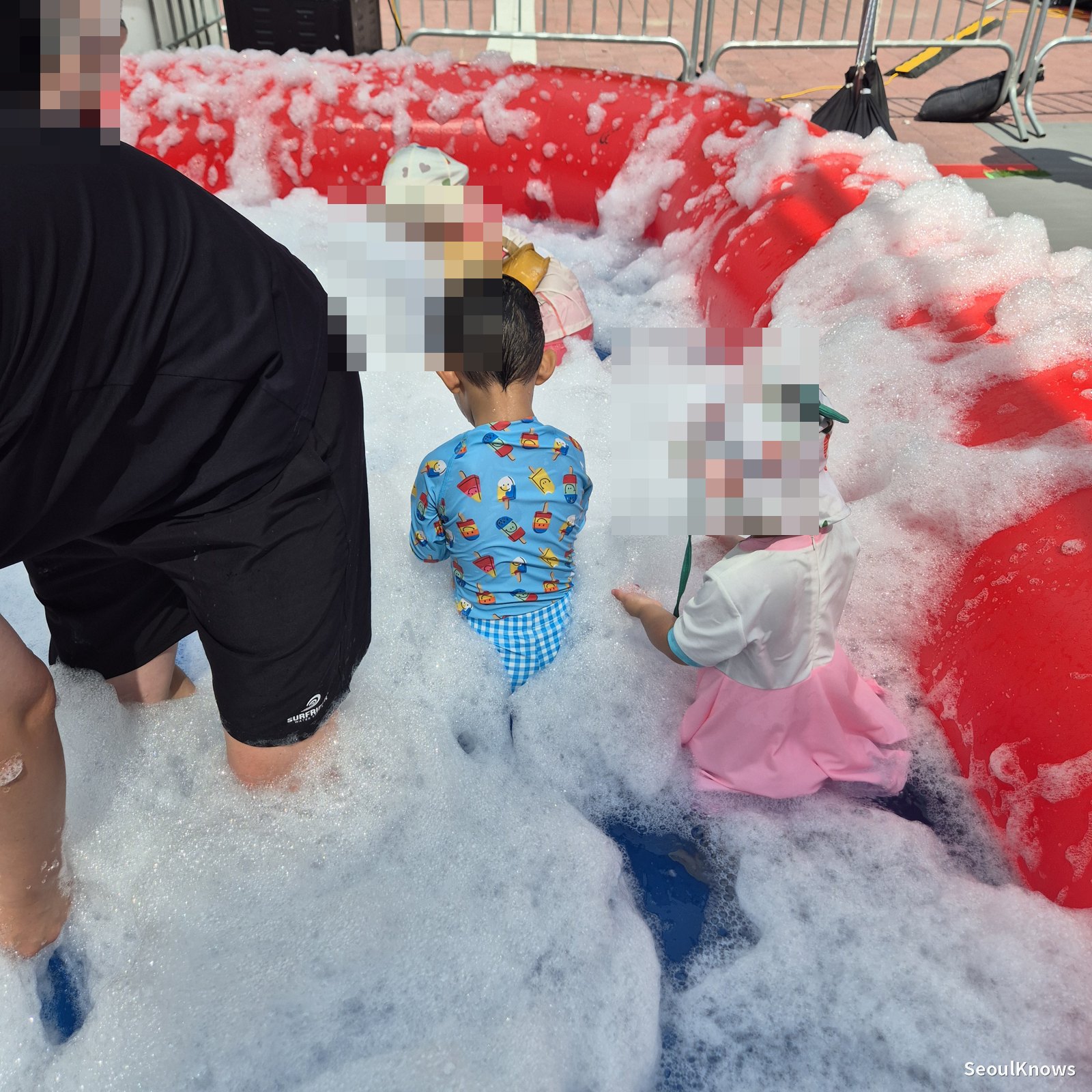Child playing in the foam