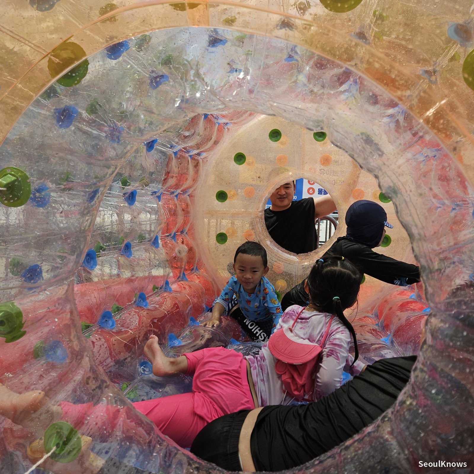 Inflatable water roller with kids