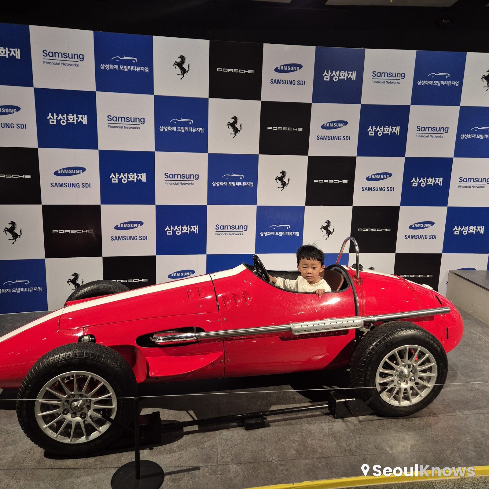 F1 racer photo zone with a child at the museum