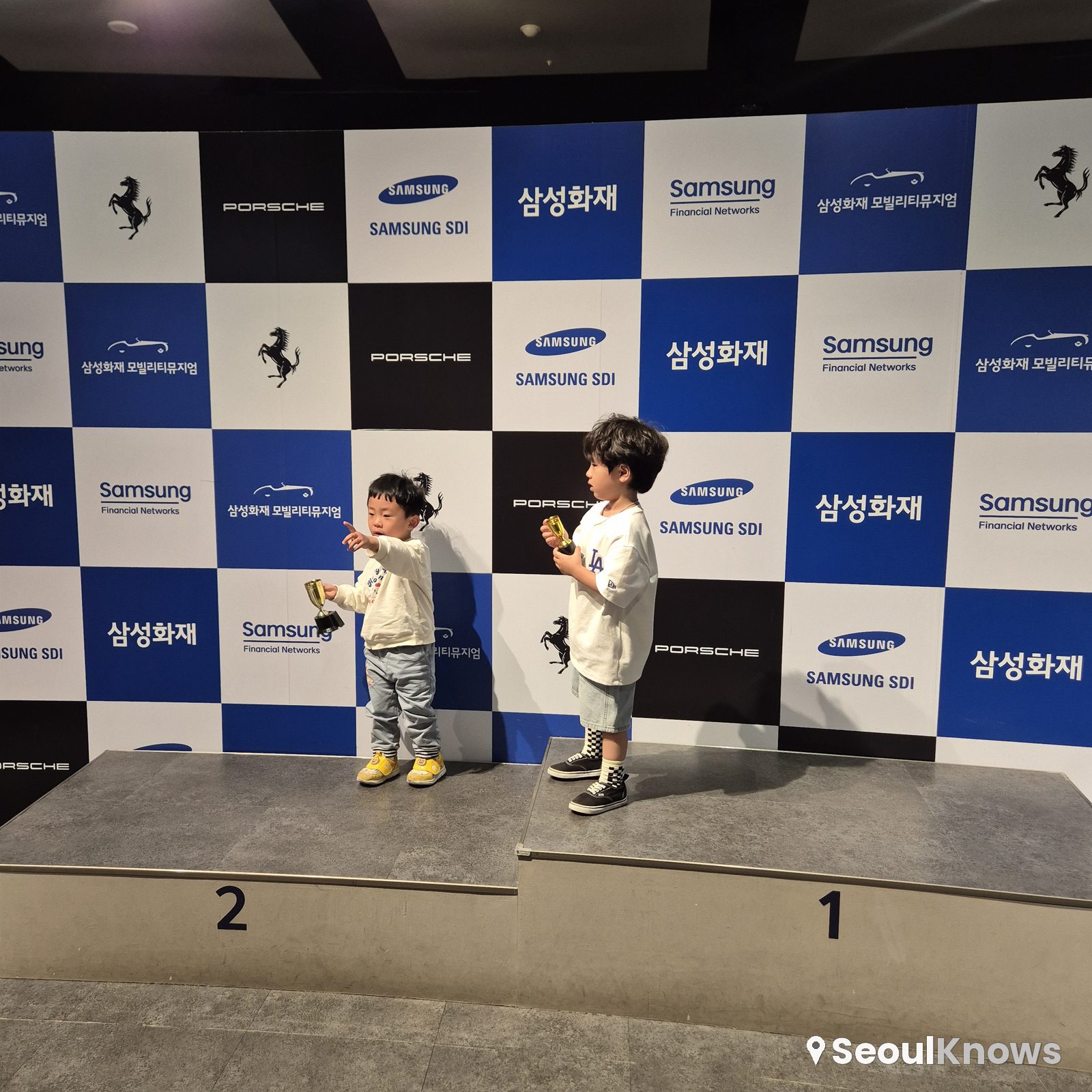 Winners' podium photo zone with kids