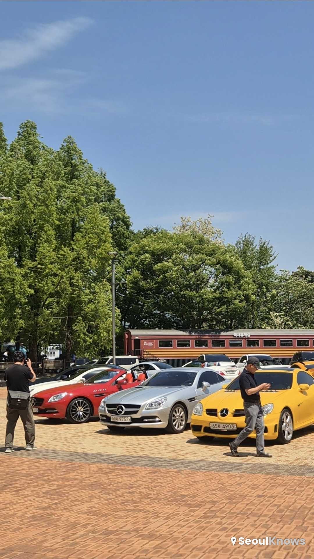 Classic cars parked outdoors near the museum