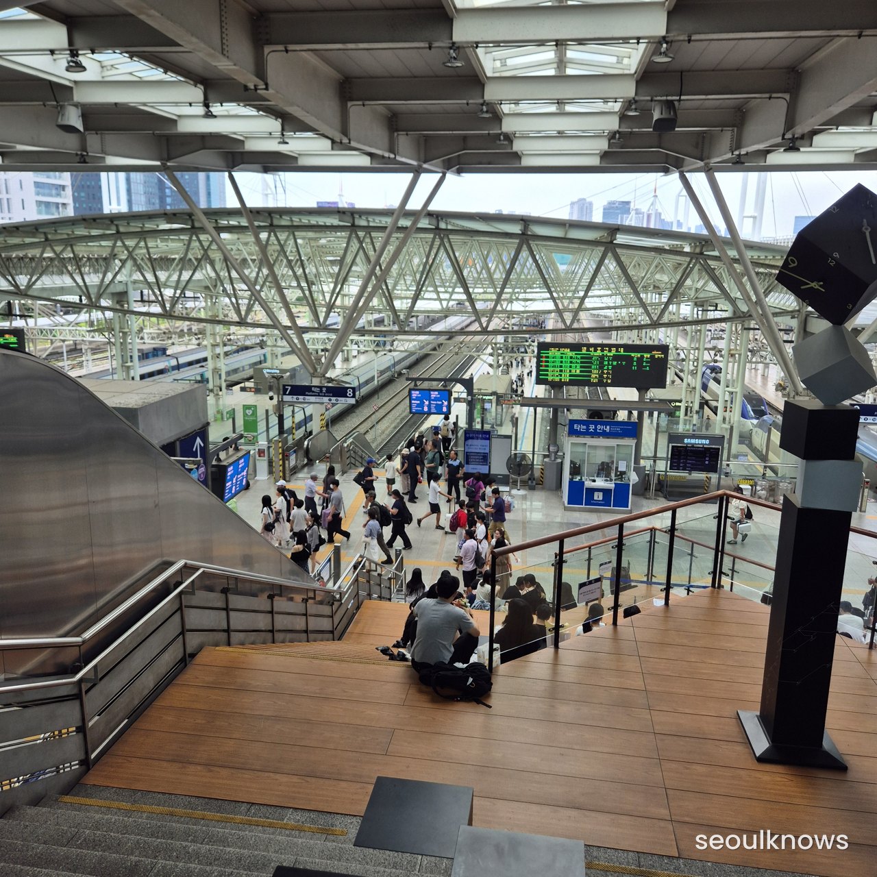 People sitting on the Seoul Station staircase
