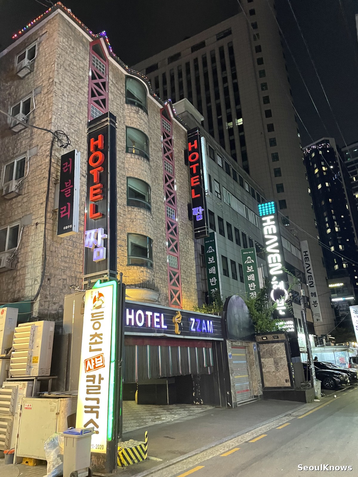 Motel signs lit up at night in Seoul