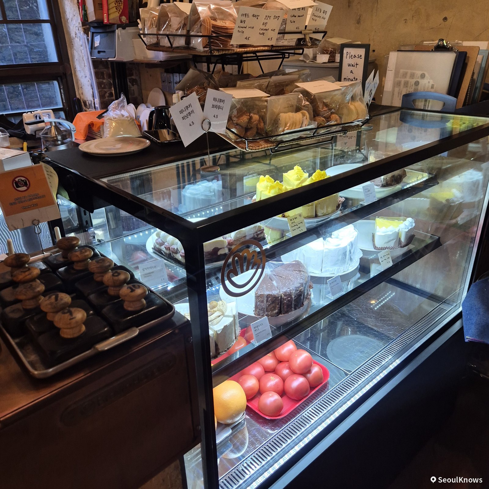Dessert showcase with cakes and pastries at Brown Hands Baekje