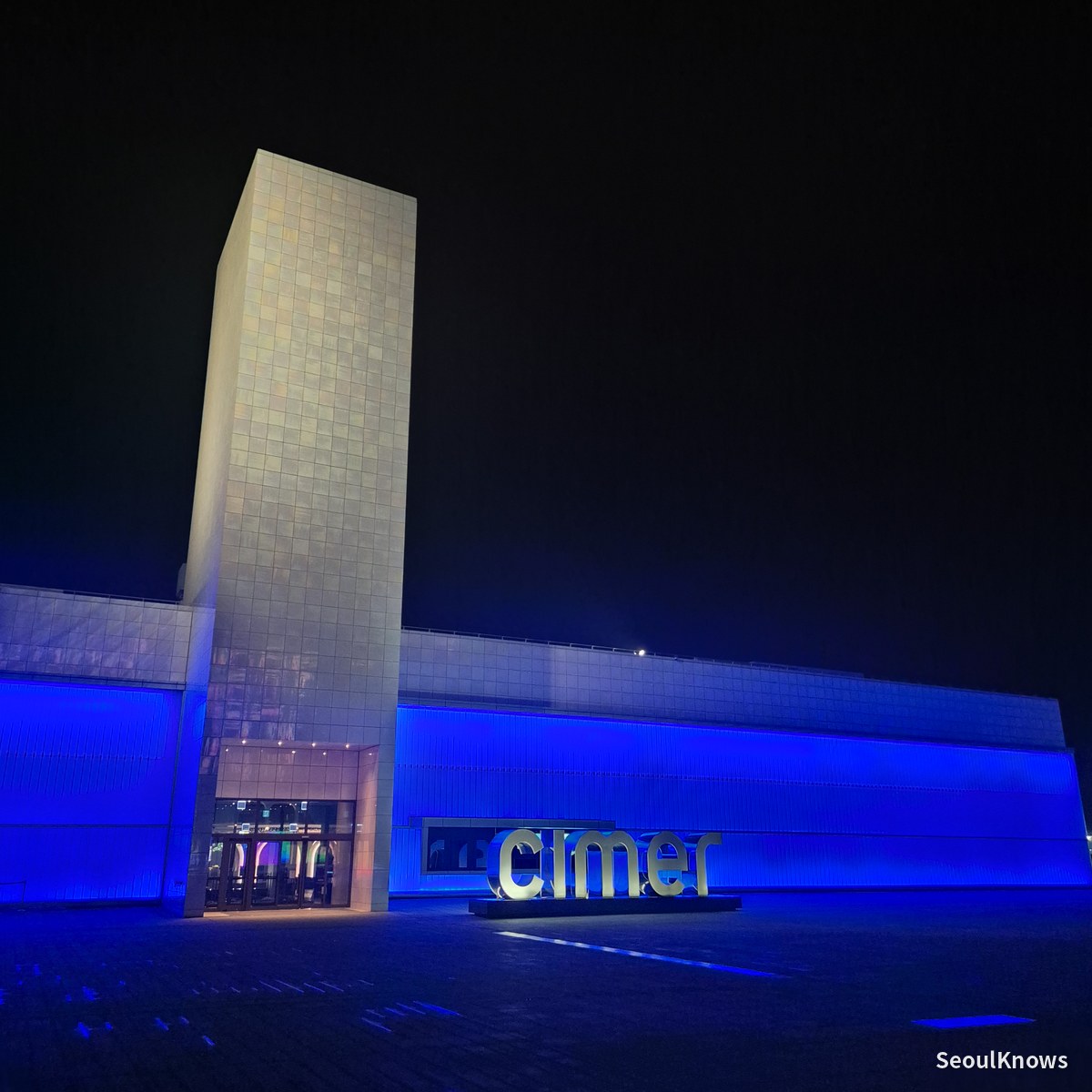 Cimer entrance sign lit up blue at night, Paradise City Incheon