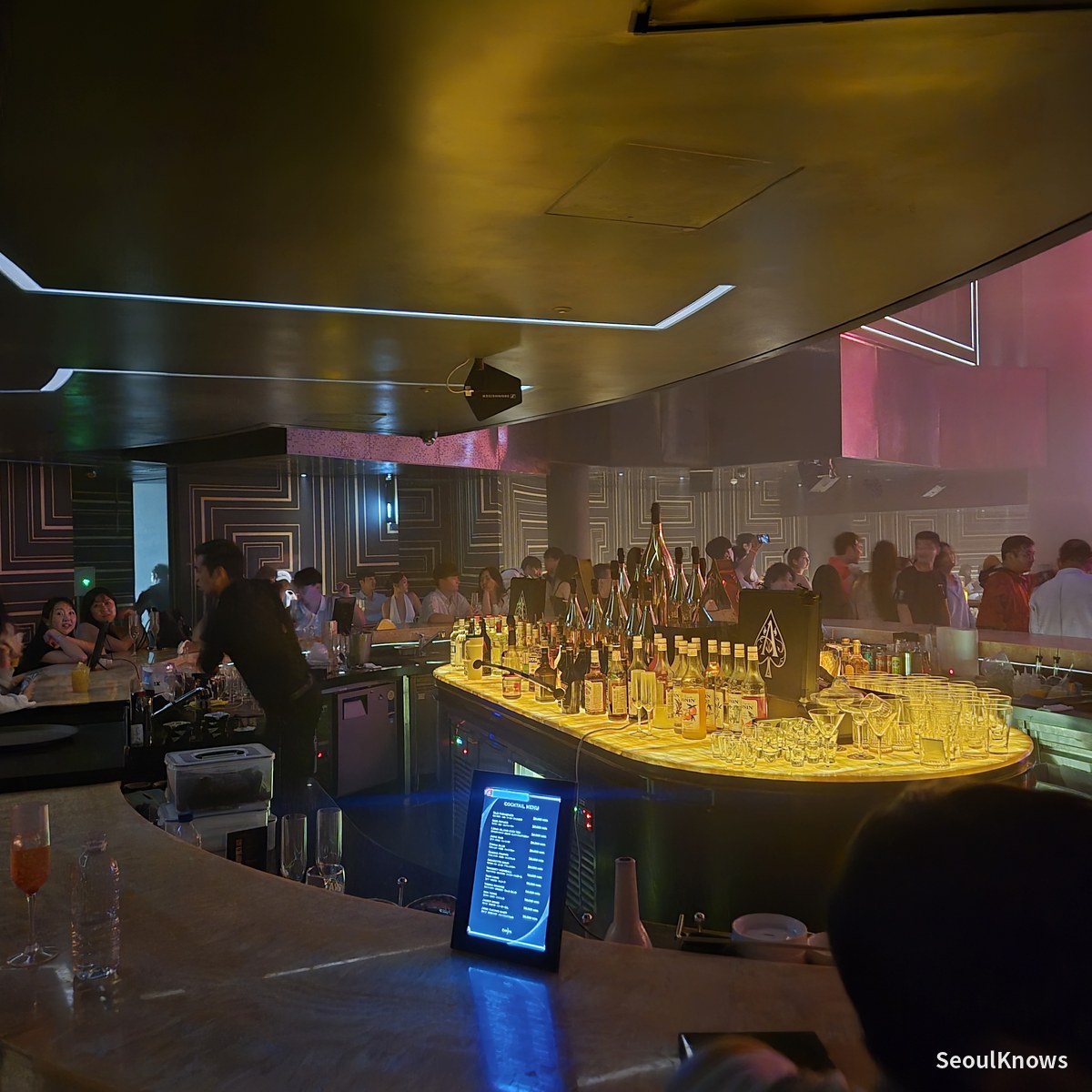 The gold curved bar at the centre of the Club Chroma main room