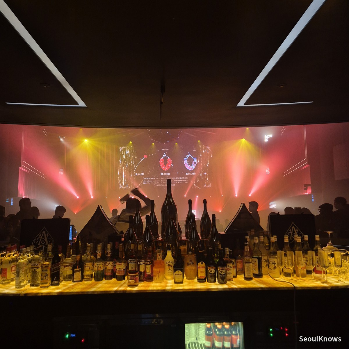 Champagne and spirits lined up along the Club Chroma bar