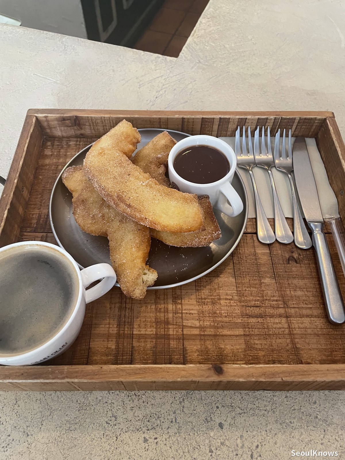 Porras with dark chocolate dipping sauce and coffee tray