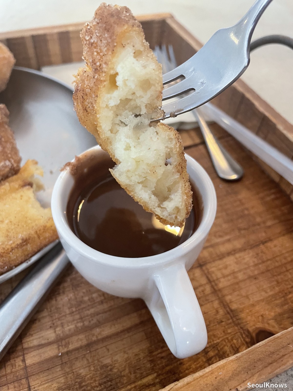 Dipping porras into chocolate at Gluglu Seoul