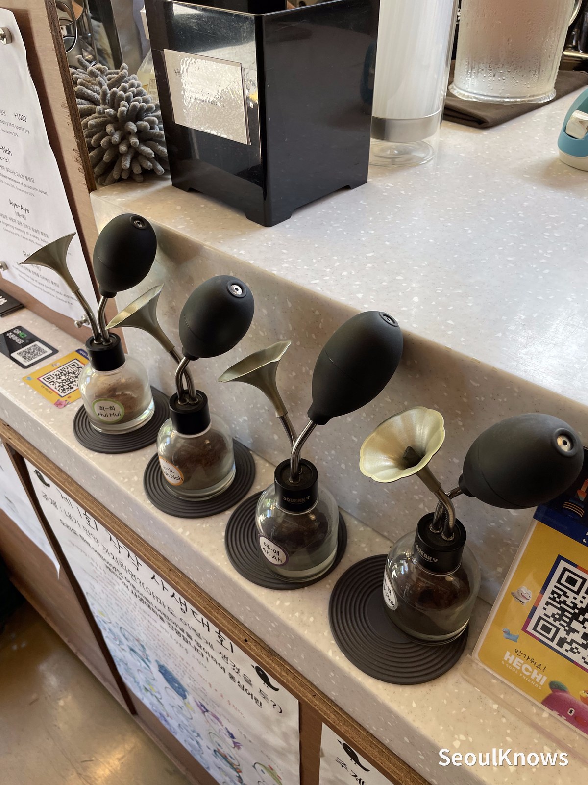 Servers and drippers lined up behind the counter