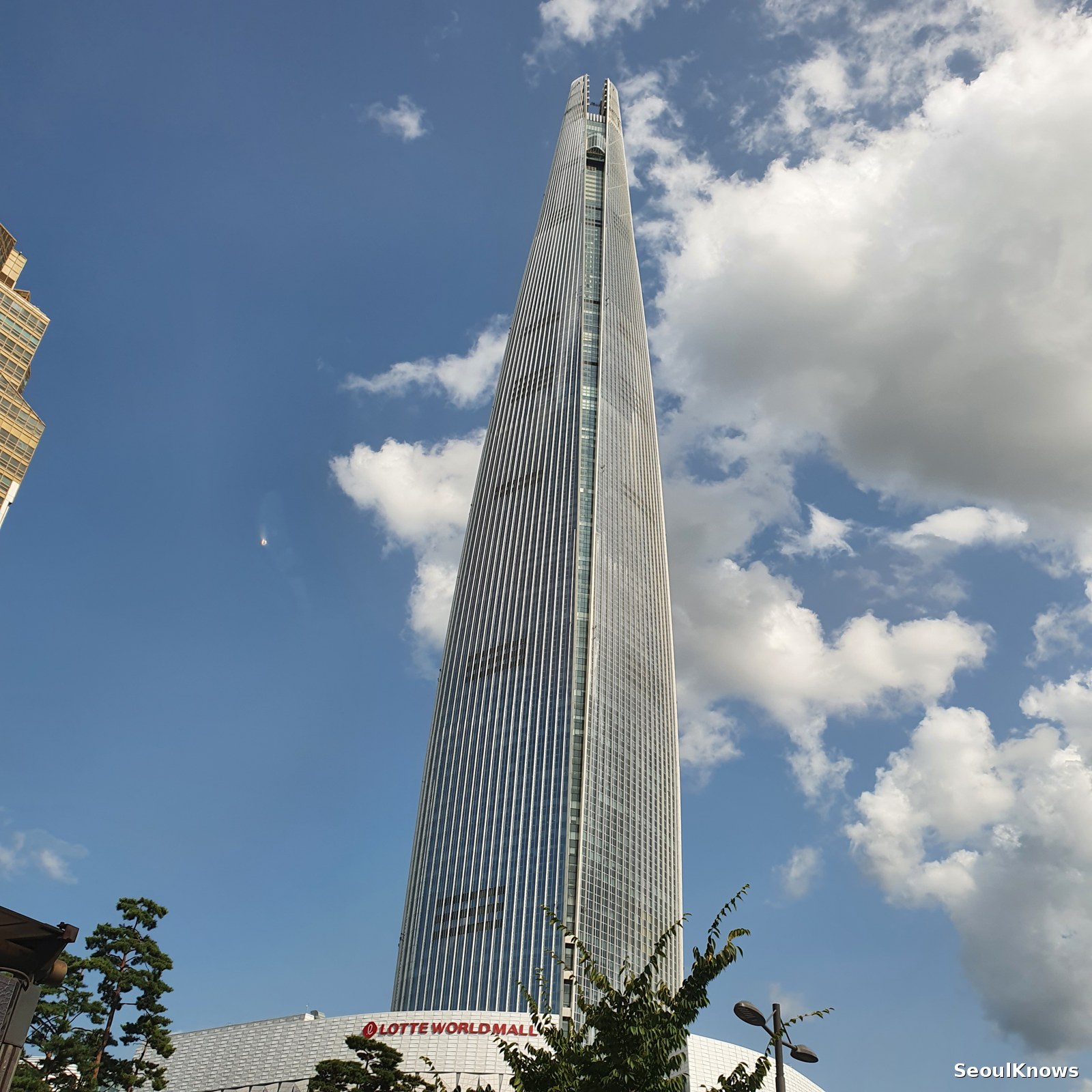 Lotte World Tower against a blue summer sky
