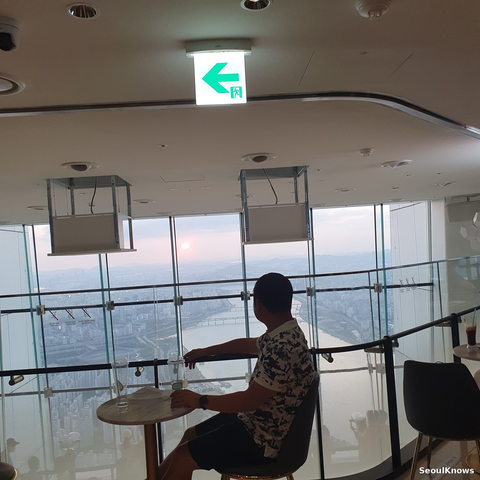 Window seat at the Seoul Sky cafe on the 122nd floor at dusk