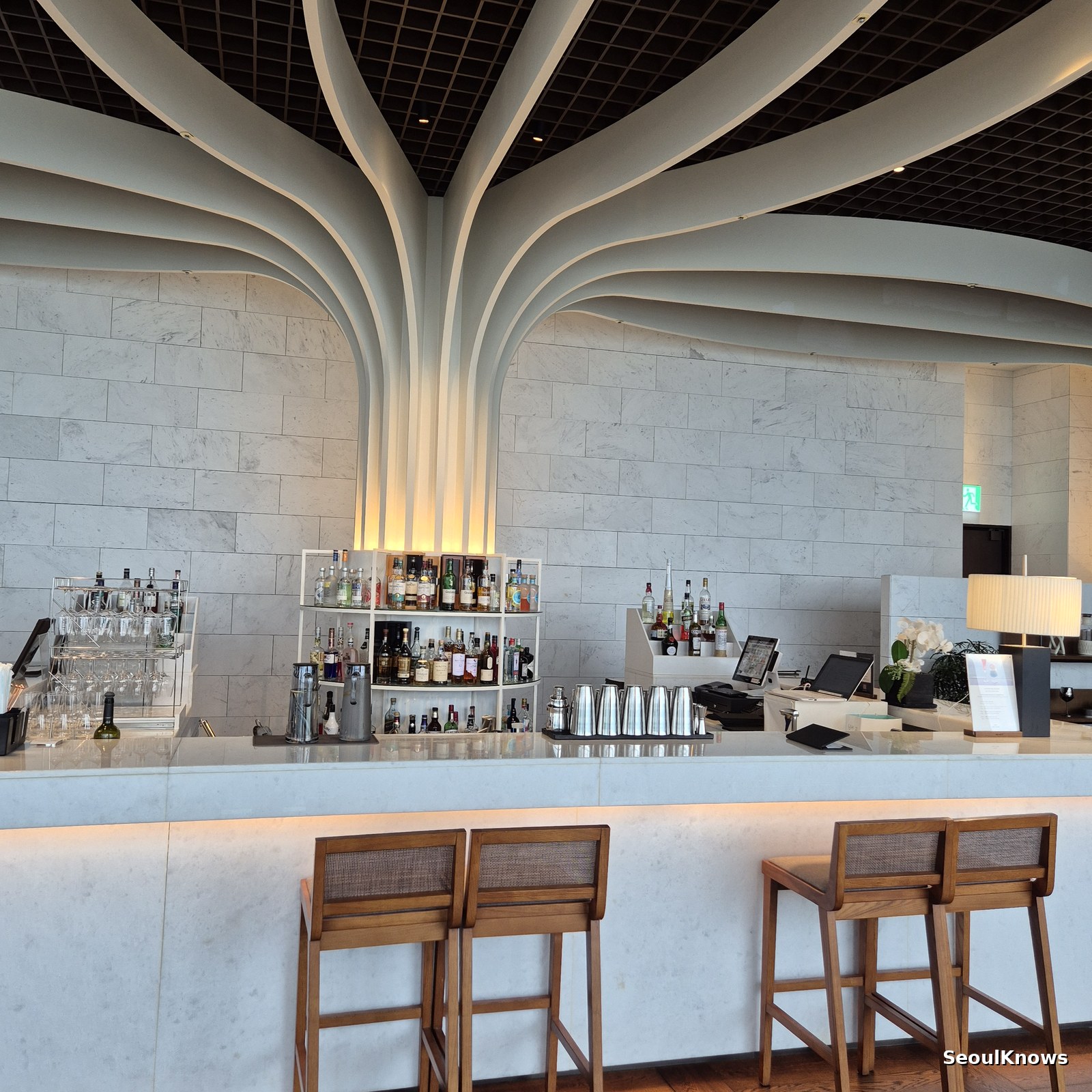 Sculptural tree-column ceiling inside McQueens Grill and Bar Busan
