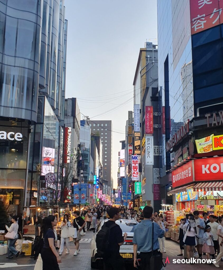 Shoppers on the main shopping street in Myeongdong, Seoul