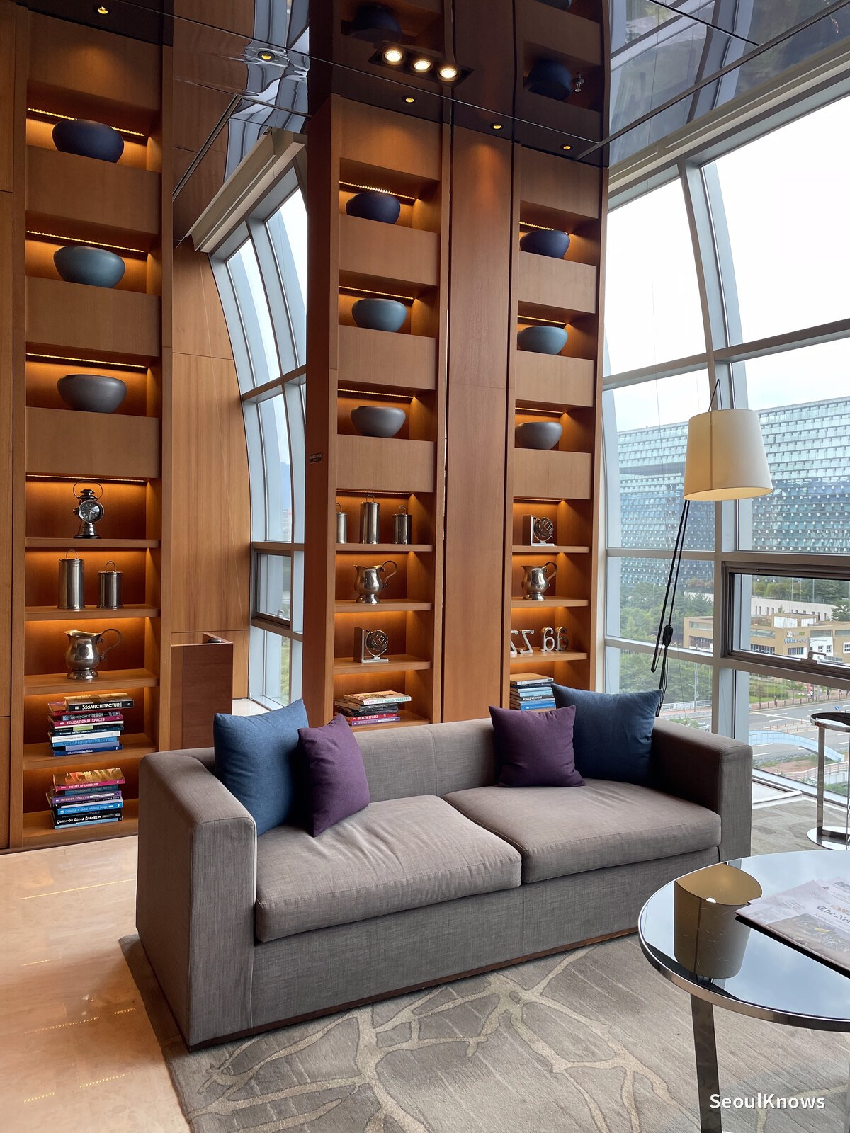 Lounge armchairs and window seating in the hotel lobby